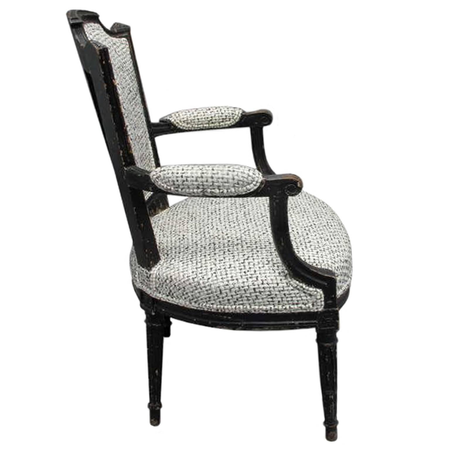 1940s French ebonized armchair upholstered in black and ivory bouclé.