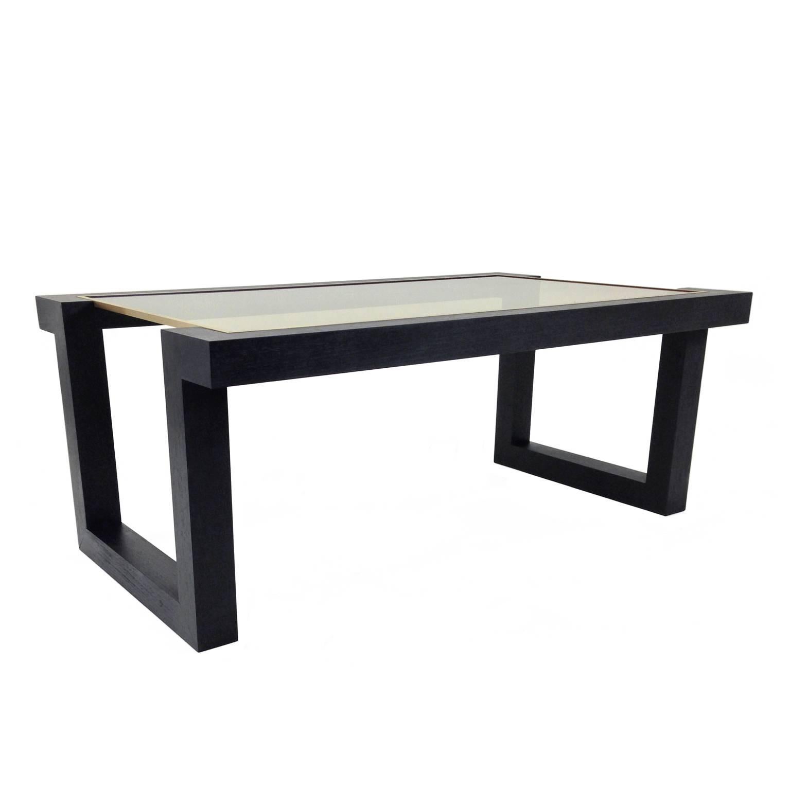 FLAIR Home collection custom black ash veneer on solid ash wood cut-out leg coffee table with brass inlay and bronze glass.

The FLAIR Metropolis collection is custom-made in New York. Each piece is handmade by a master woodworker using the finest