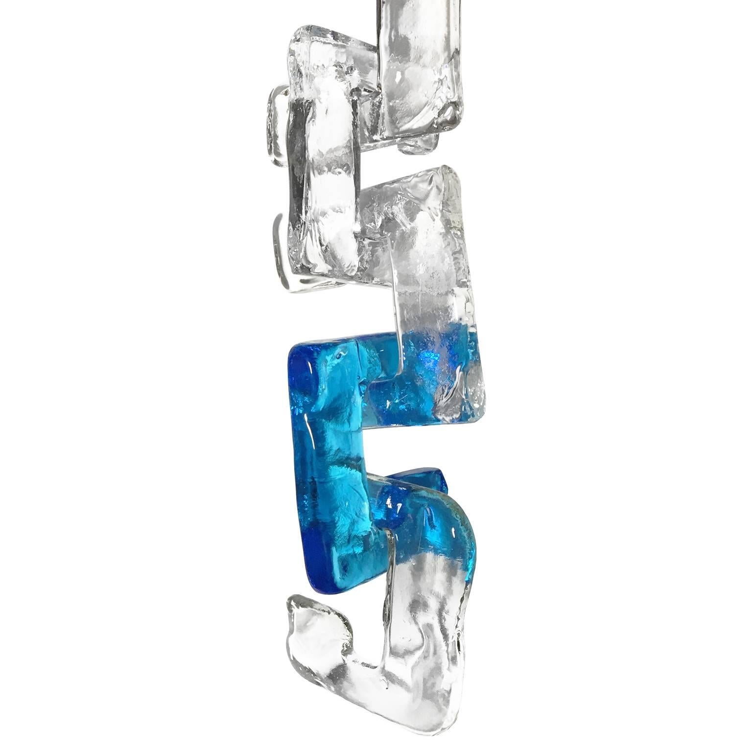 1960's Italian four-tier interlocking blue and clear Murano glass C link chandelier by Mazzega.