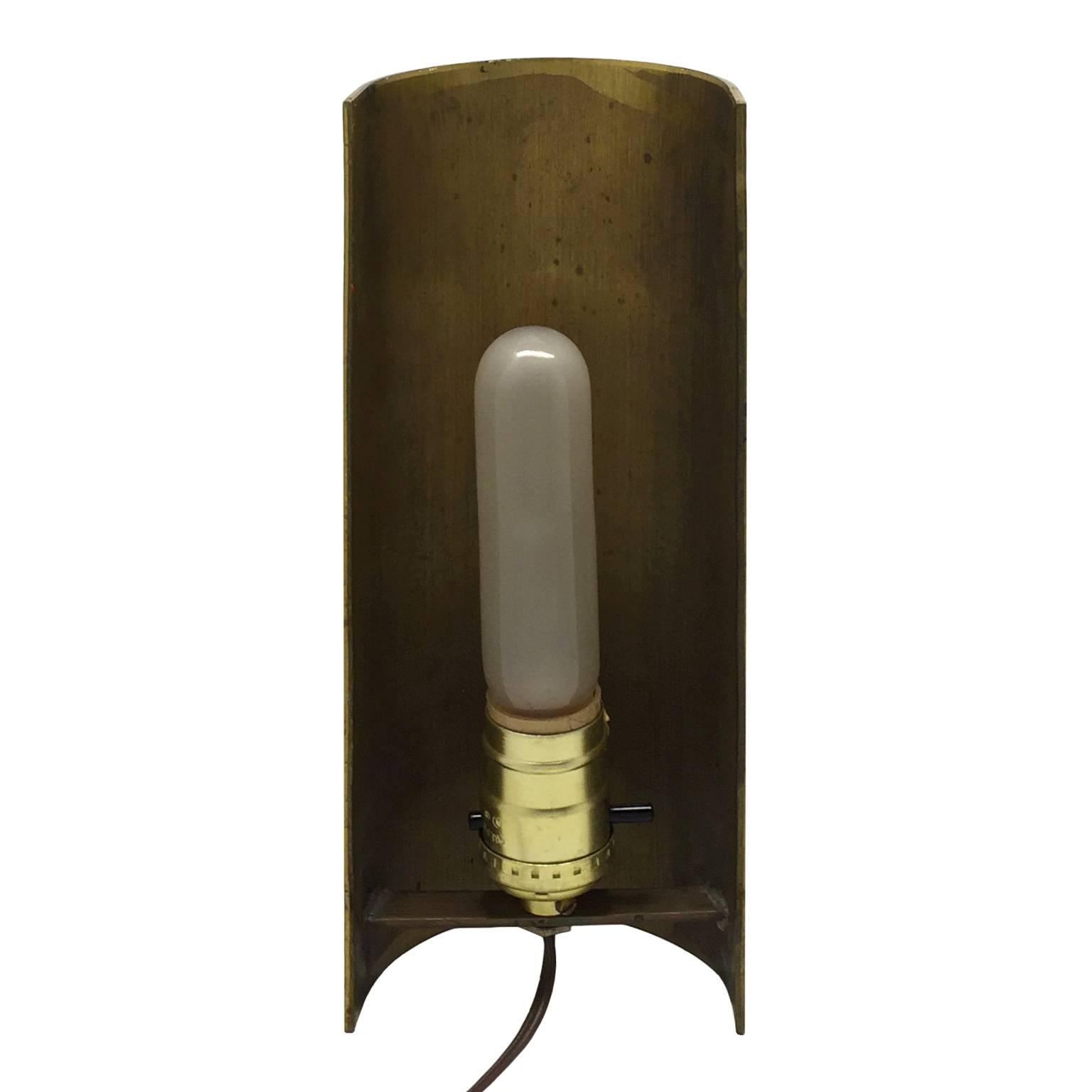 Tall brass half pipe accent lamp.