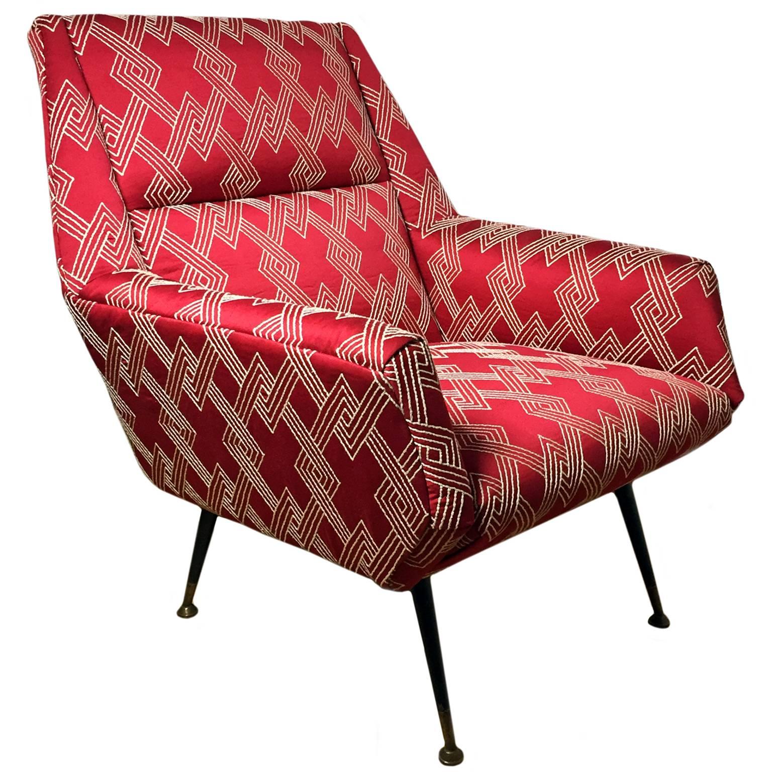 Mid-century angled back straight arm club chair upholstered in red and white geometric embroidered cotton blend fabric. Italy, 1960's. 