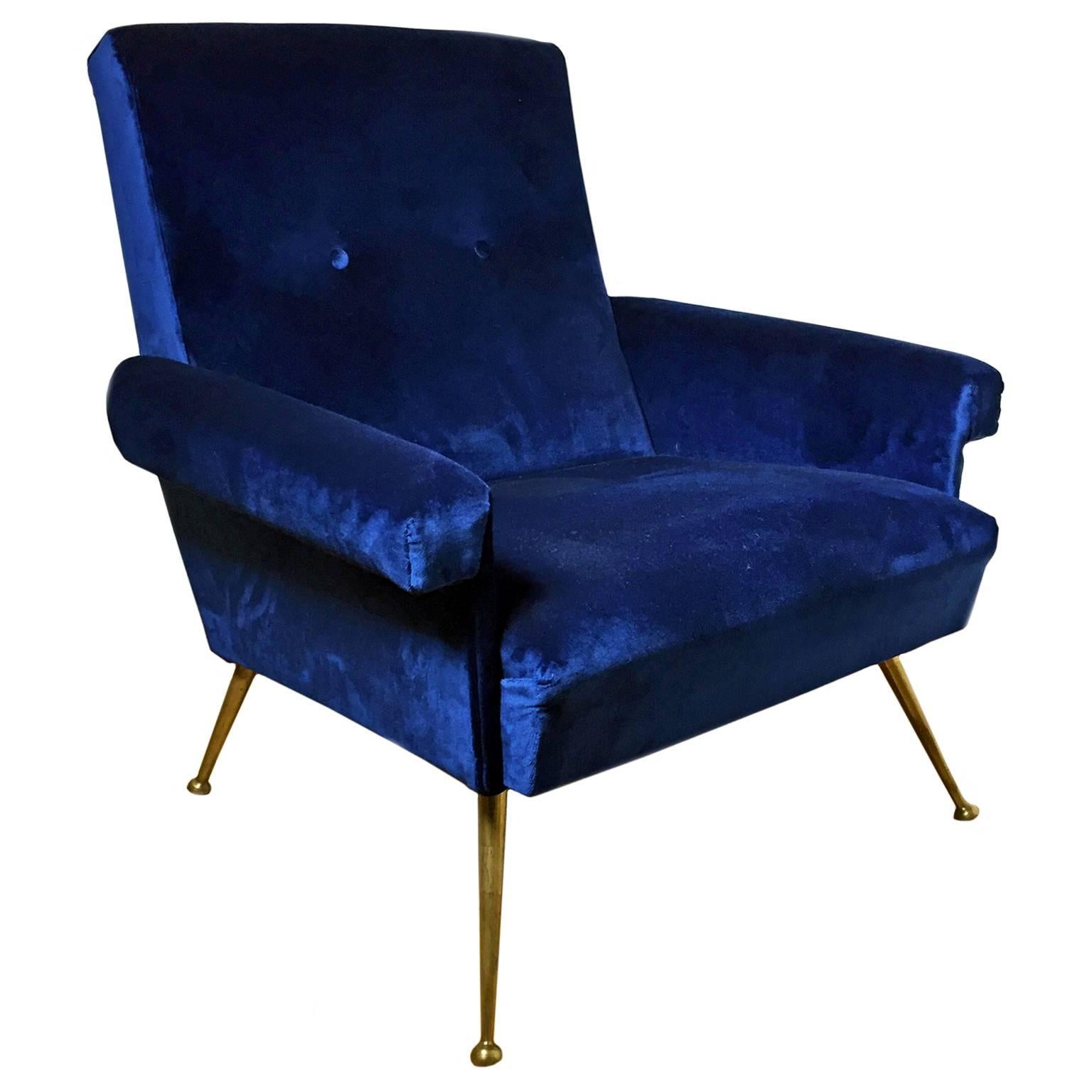 Button back club chair in navy blue velvet on tapered bronze legs. Italy, 1960's. 