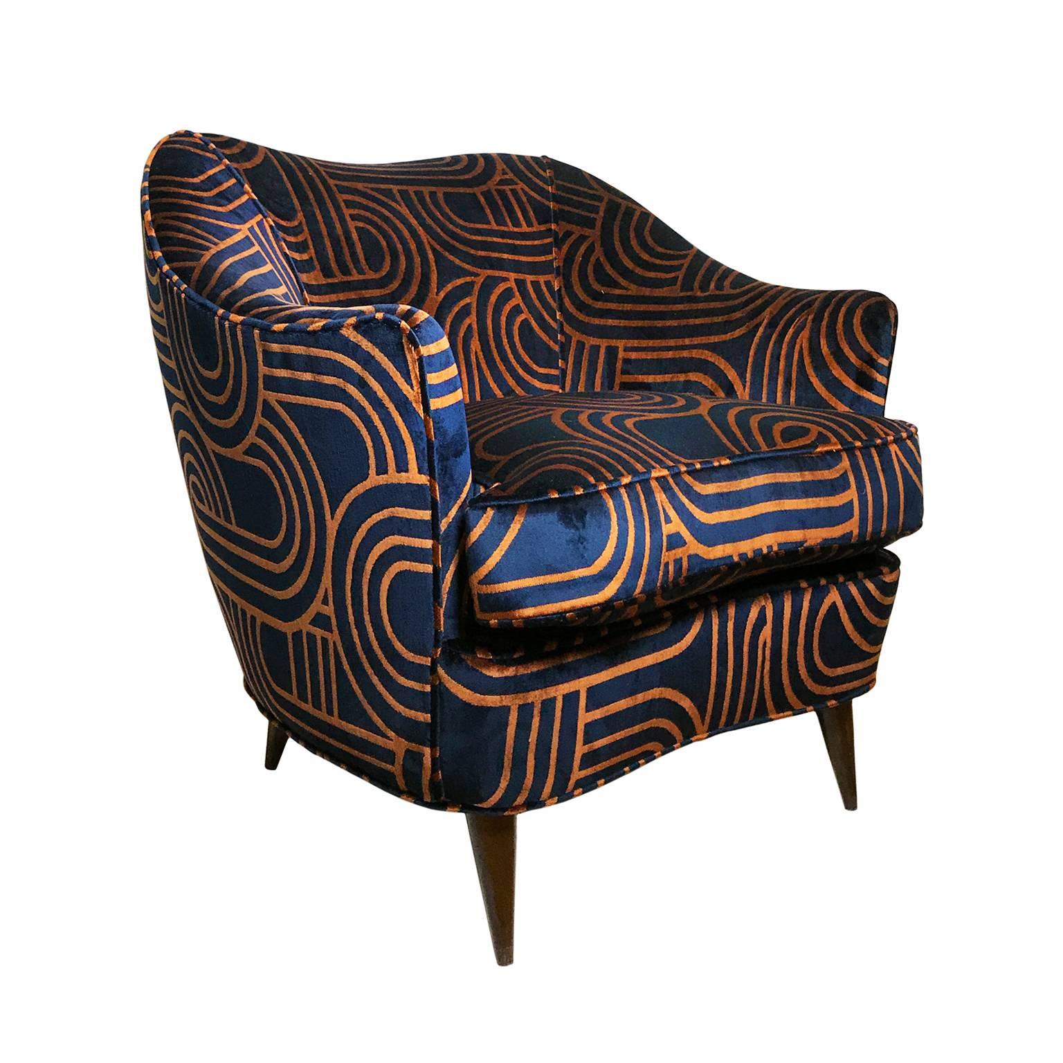 1960's Italian Gio Ponti barrel back club chair on tapered wooden legs in navy blue and copper swirl velvet upholstery. 

Pair available, priced individually.