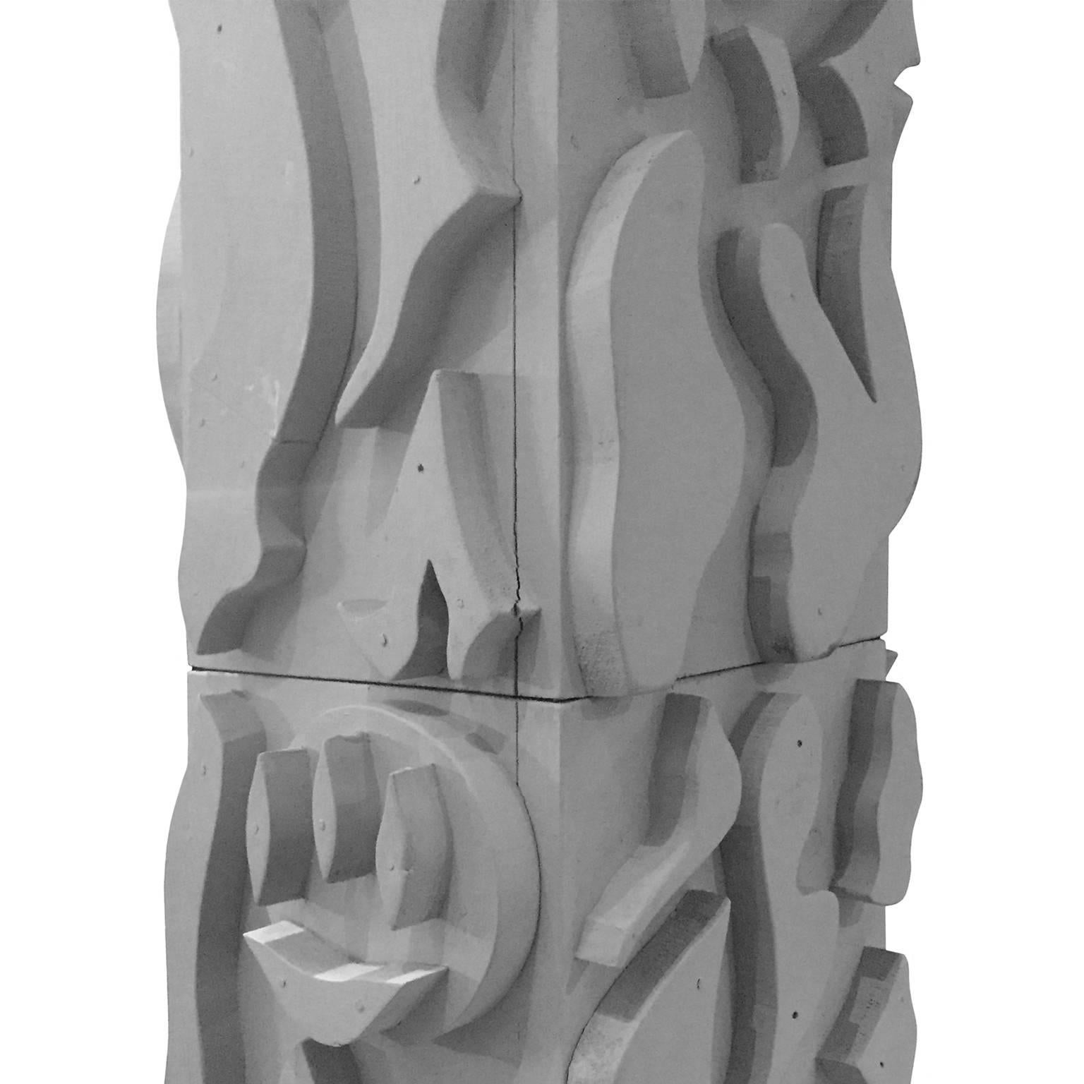 Matte grey wood totem sculpture, entitled 