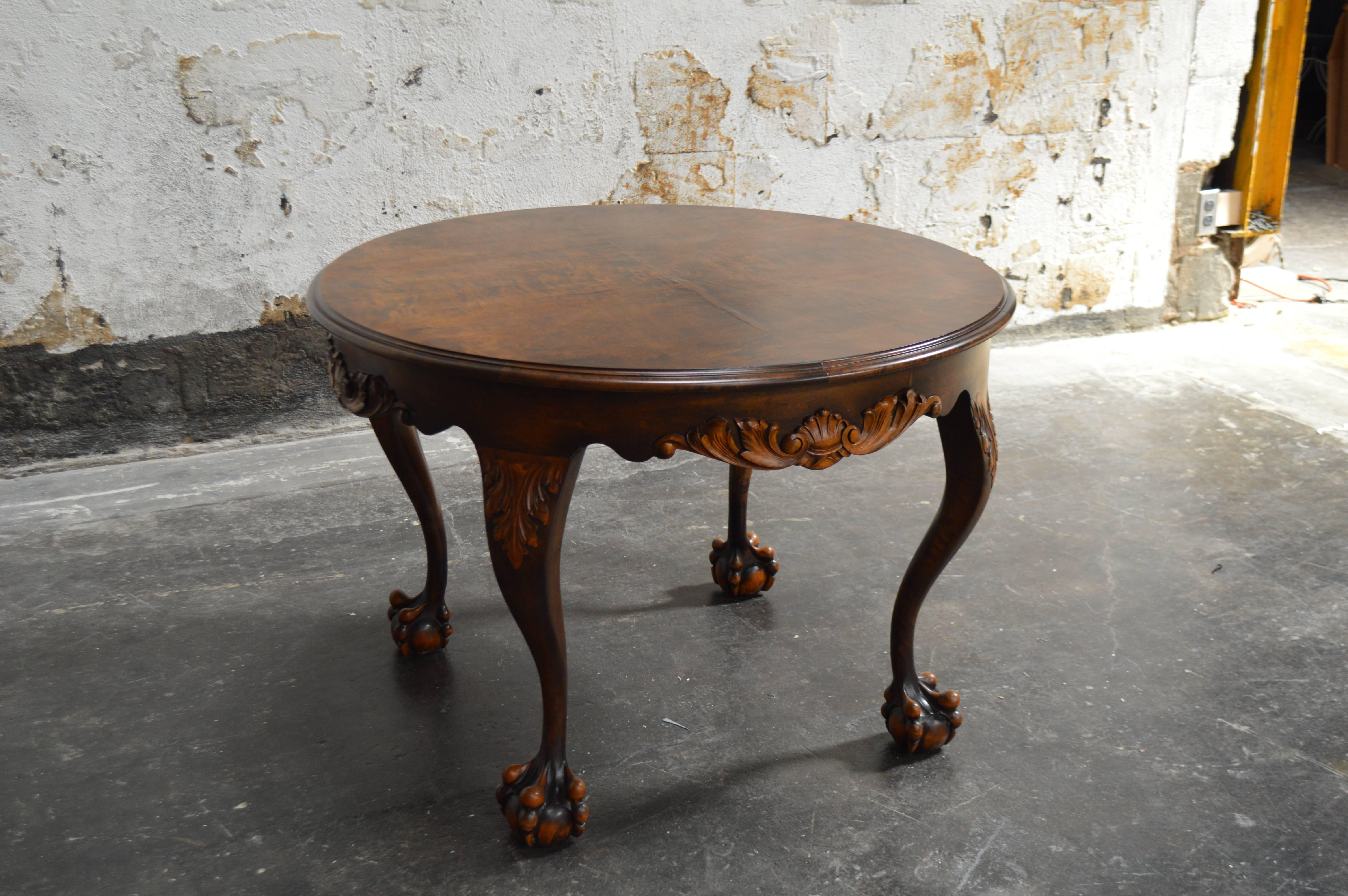 A handsome flame birch side table of mid-18th century design with elaborately executed trim and lightly shaped cabriole legs with scrolls carving terminating in high ball in claw feet. This table has been restored by our in-house craftsmen. There