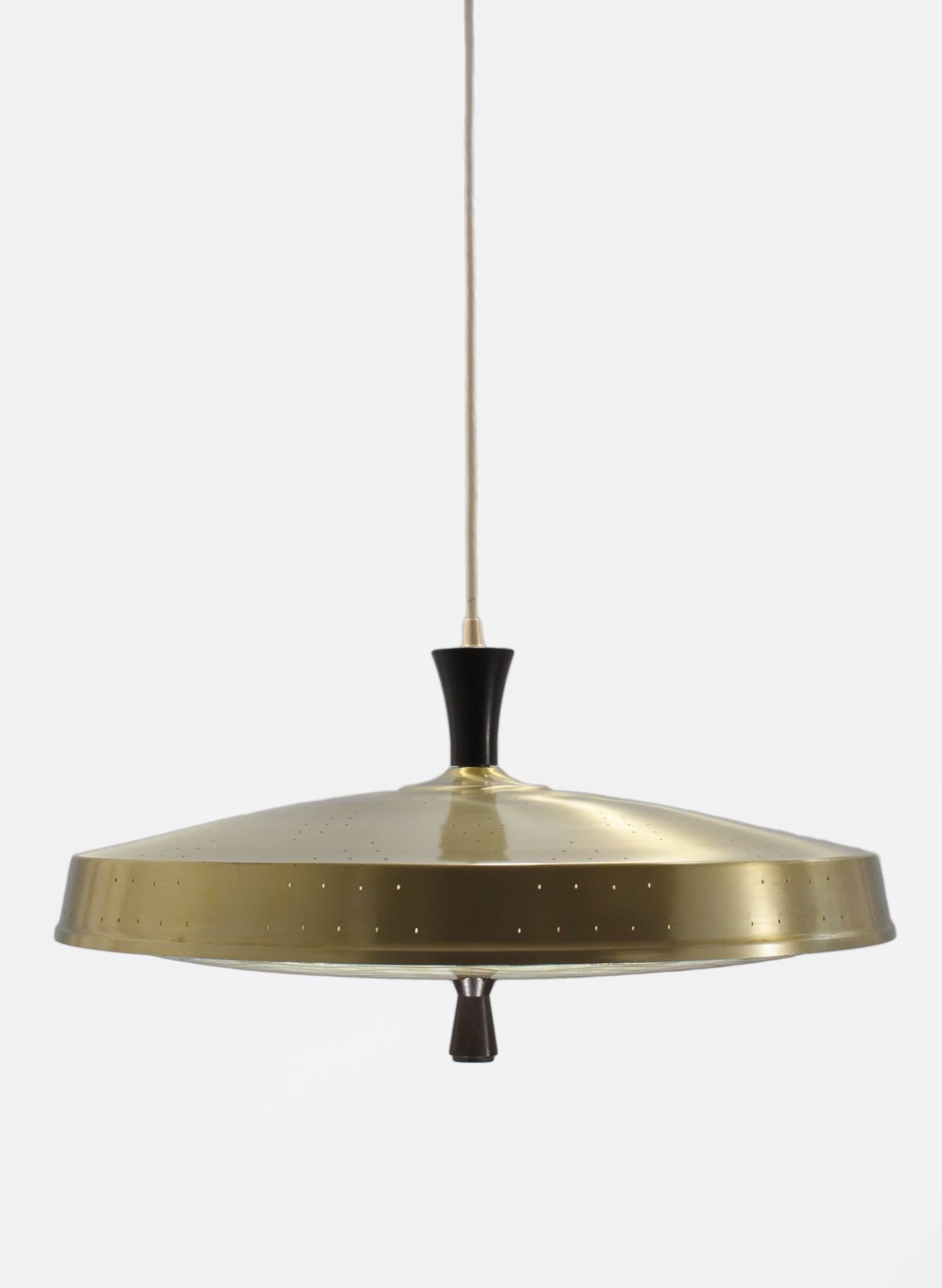 A 1950s pendant in the style of Gerald Thurston featuring a dazzling Murano glass diffuser detailed in 14-karat gold paint. The fixture has a classic Space Age 