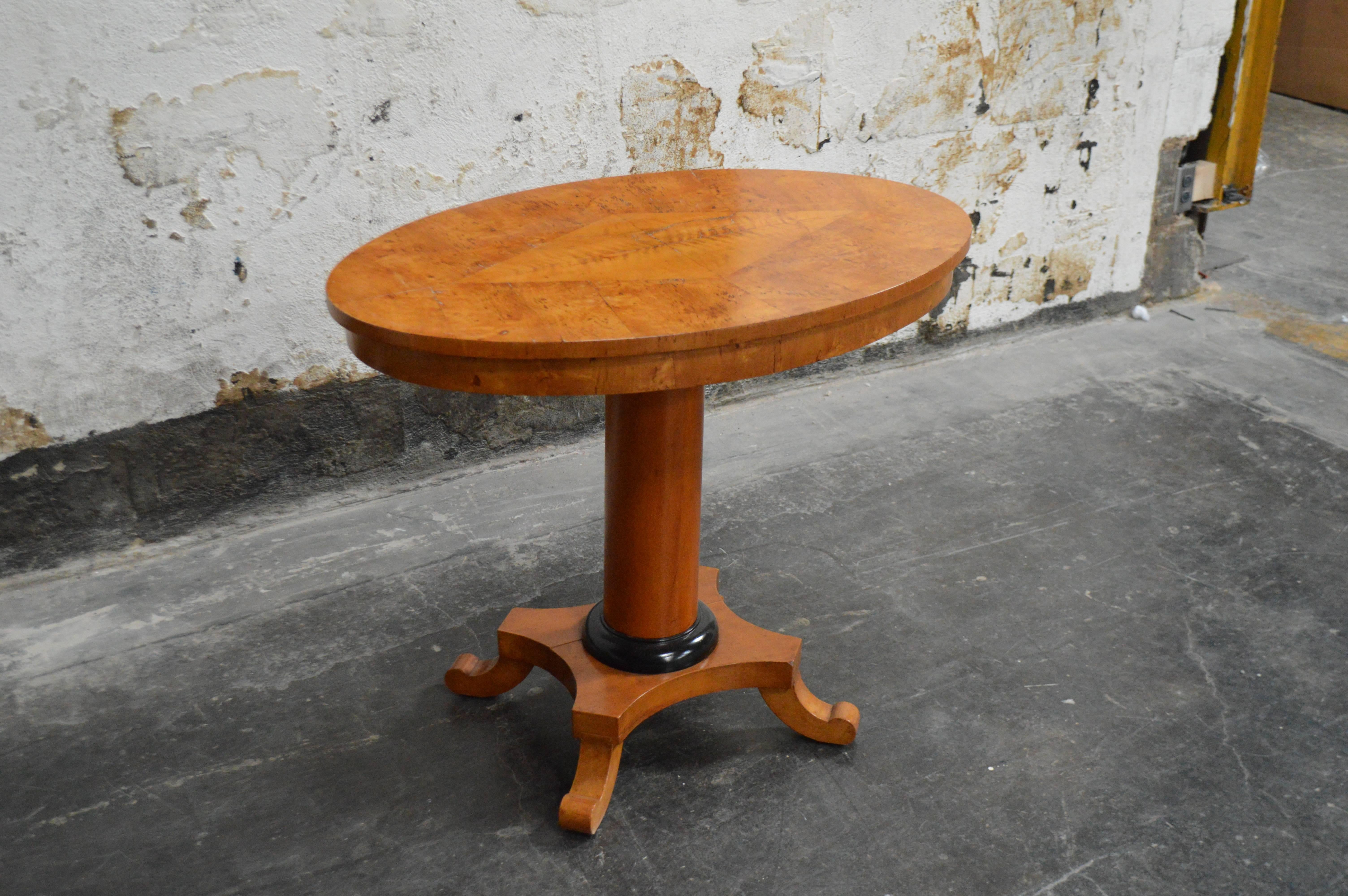 Swedish Karl Johan (Biedermeier) center or side table. Pedestal base with ebonized accents. Burl wood top with center diamond inlay. Very handsome piece and graciously scaled to be a end or side table or can even be used as a petite game table