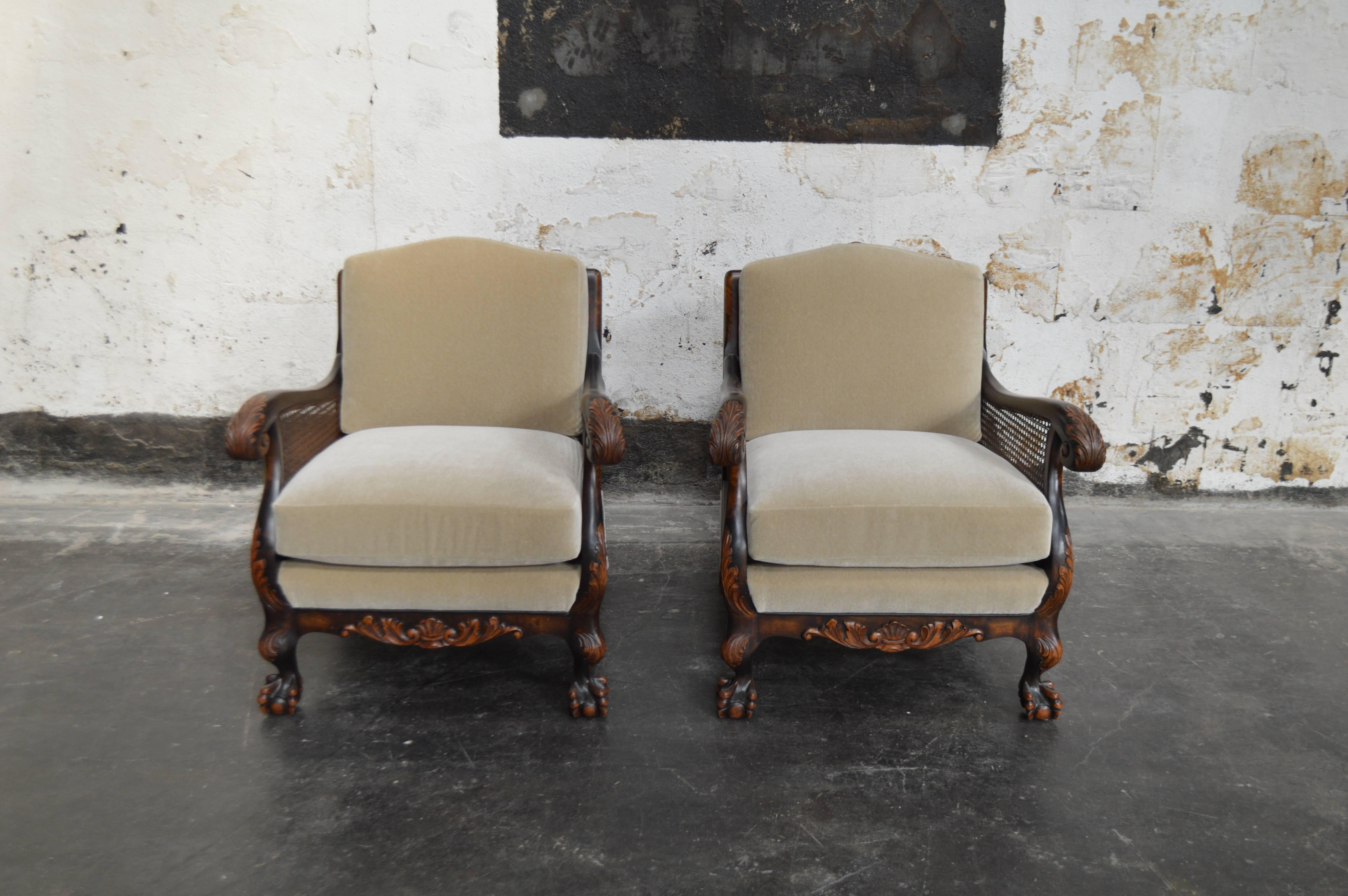 Pair of dark flame birch carved armchairs newly upholstered in beige mohair. Features caned back and arms and exposed carved wood that has a handsomely aged patina. Cushions have eight-way hand-tied springs and new recycled foam.

Fabric swatch