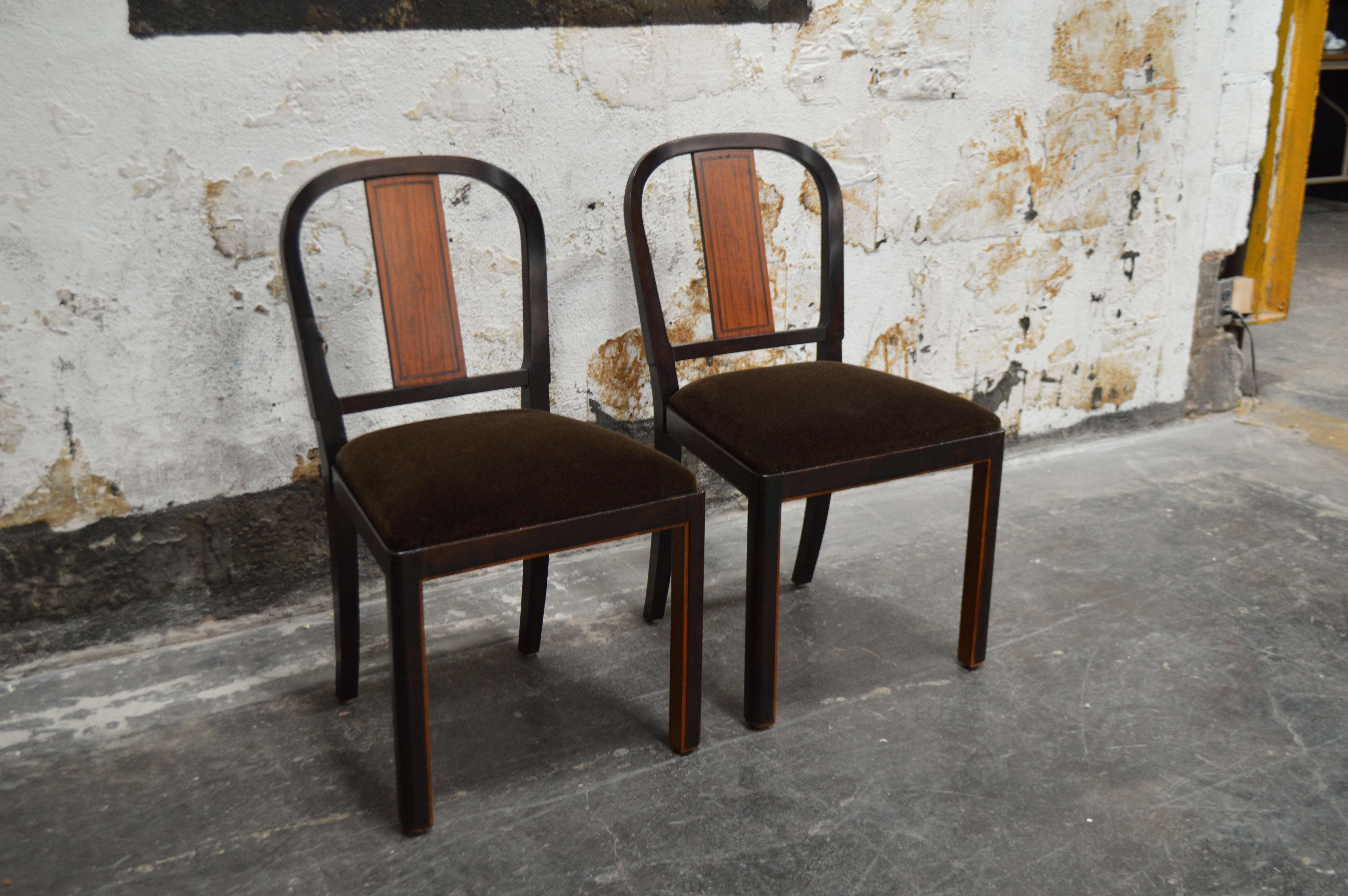 Fantastic pair of Carl Malmsten chairs inlaid rosewood and flame birch. Contrasting wood detail on the inside legs and back. Restored and finished on all sides. New chocolate brown mohair upholstered seats.

Note: These pair nicely with a desk we