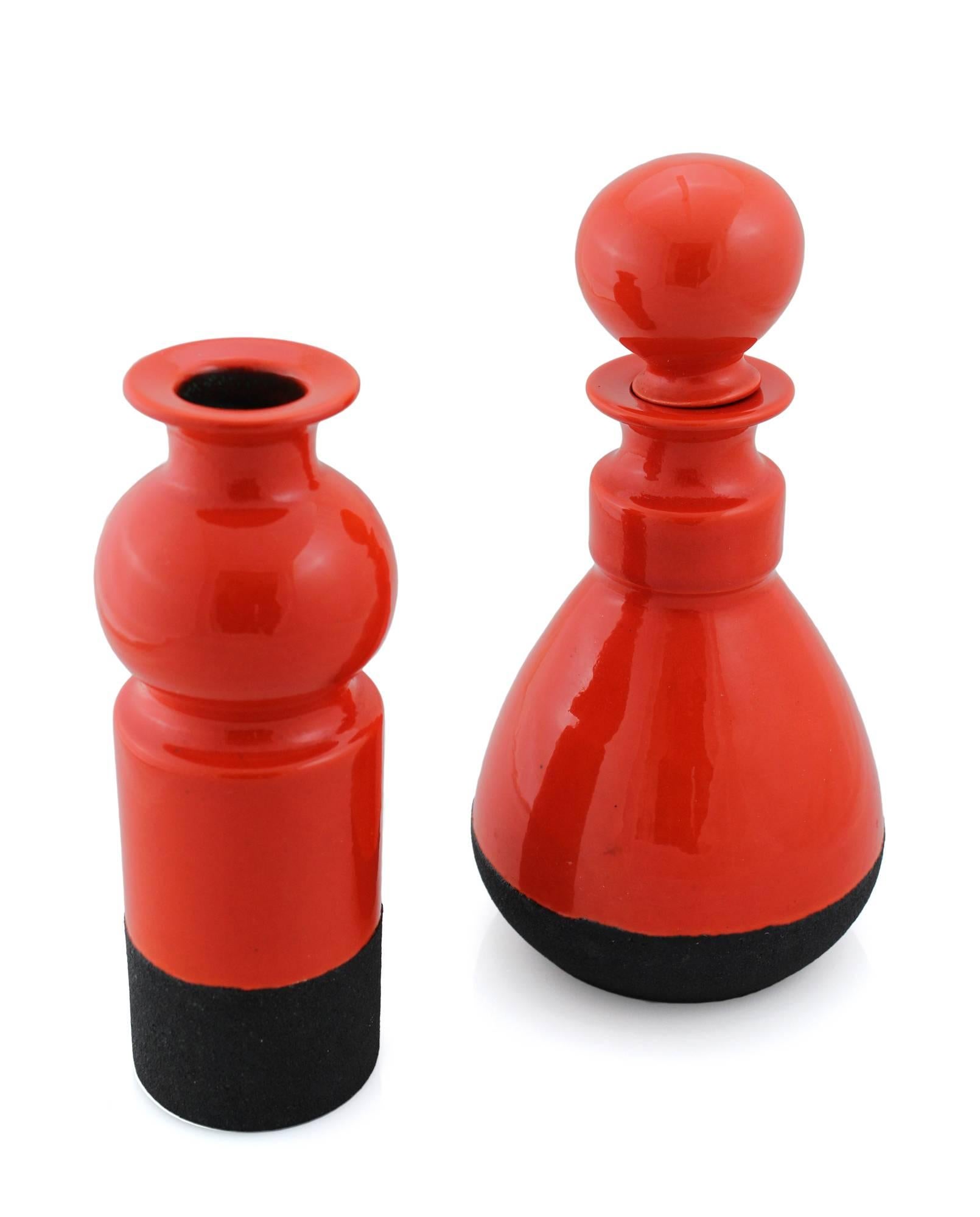 A very rare carafe and bud vase in sharply contrasting colors and textures, designed by Ettore Sottsass for Bitossi in the 1950s, but not produced until the 1960s due to reputed technical difficulties in executing Sottsass' designs. Each piece