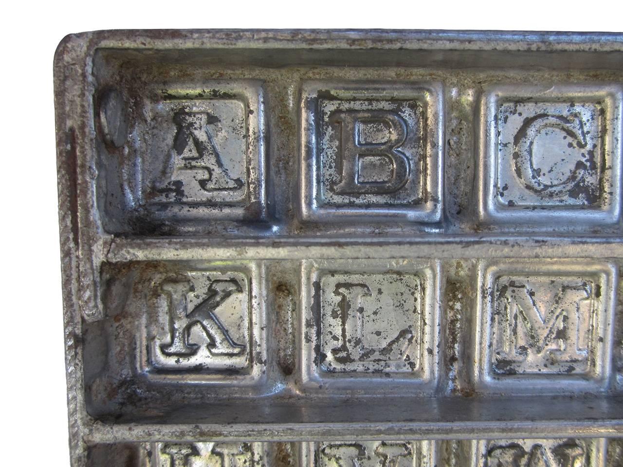 Rare early 1900s metal chocolate mold in alphabet and zero to nine numbers form, all in original and excellent condition.
