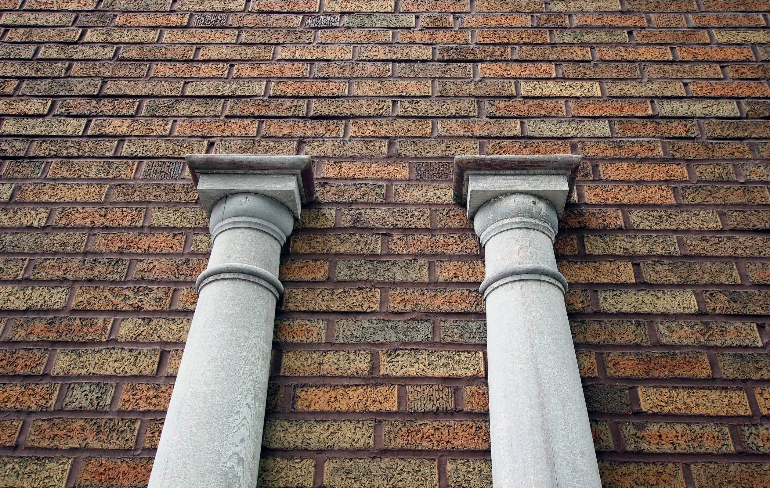 Pair of tall, graceful half round pillars with excellent turnings and moldings and in original white paint. They were likely used on the exterior of a house, as they are nicely weathered, American, late 19th century.

Small, custom contemporary