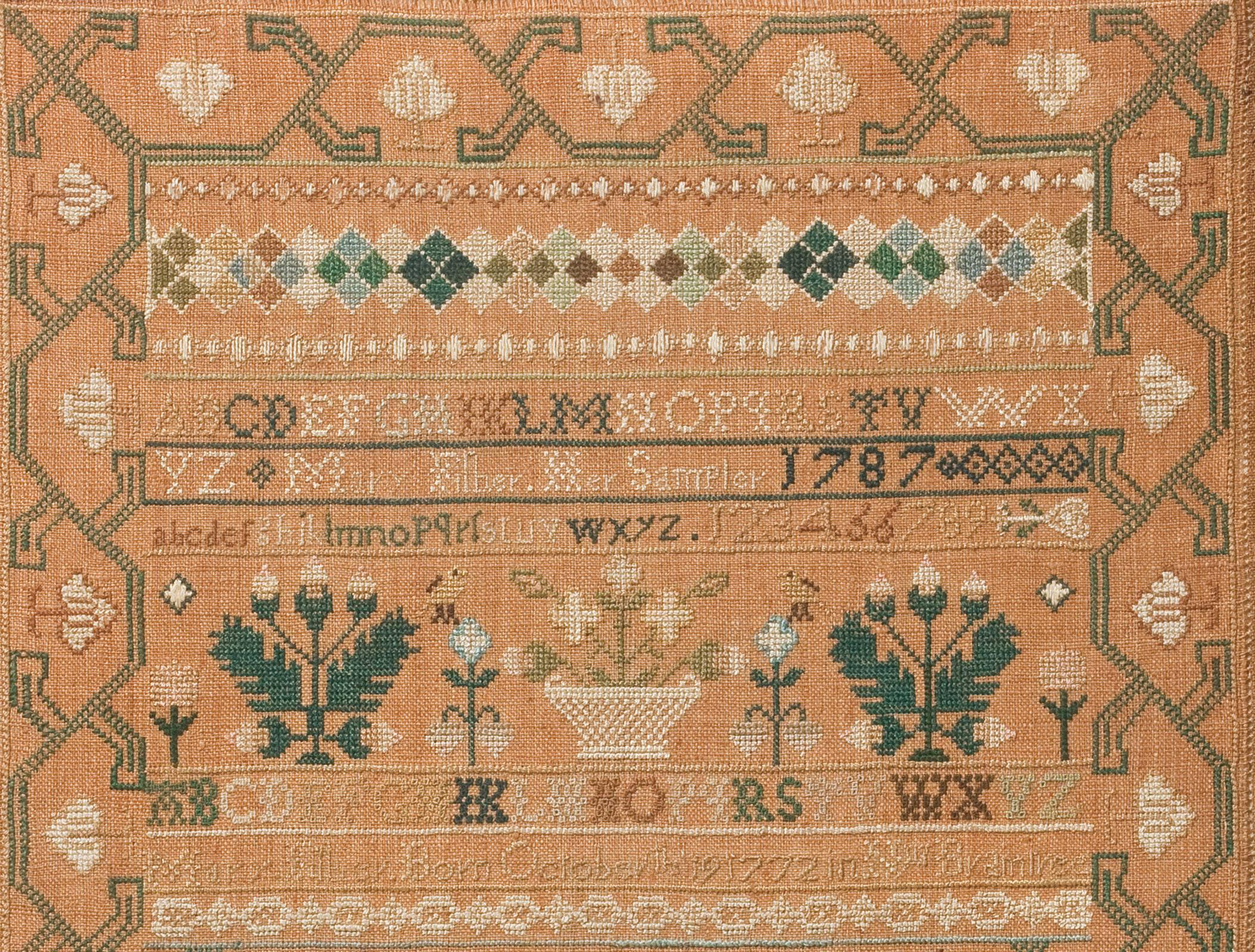 A faultlessly rendered sampler with a wonderful composition, this includes many beautifully stitched animals, birds, flowering plants and baskets; additionally, excellent bands and borders provide a handsome visual strength. It is signed, 