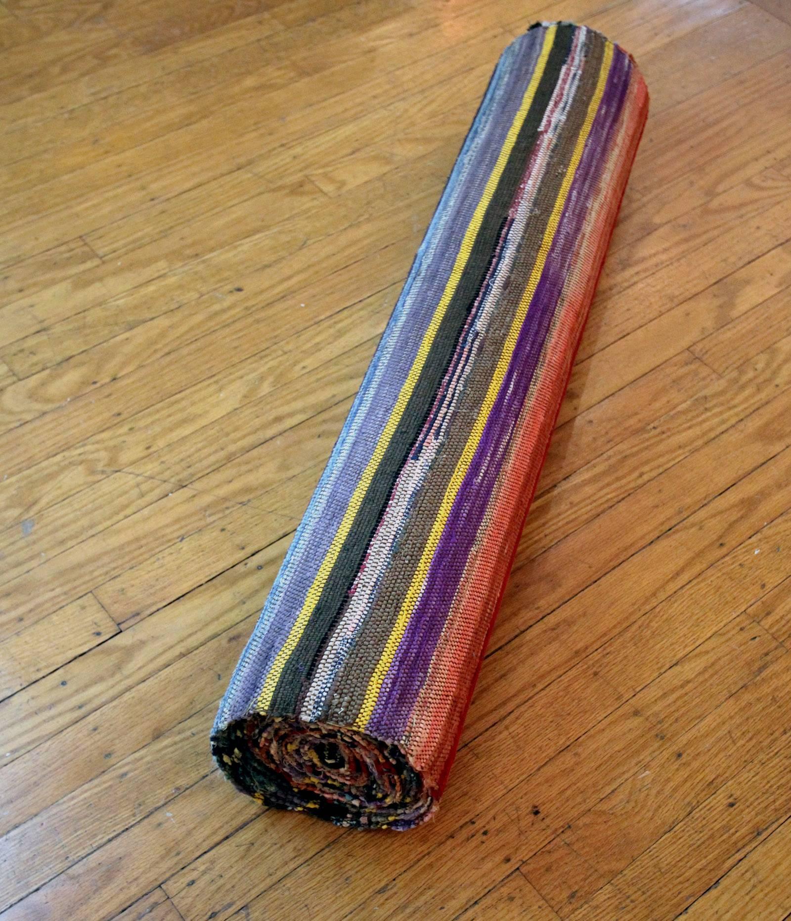 Versatile and mint condition roll of hand-loom woven rag rug (28.5' long), in excellent striped coloration. Width is 34.5