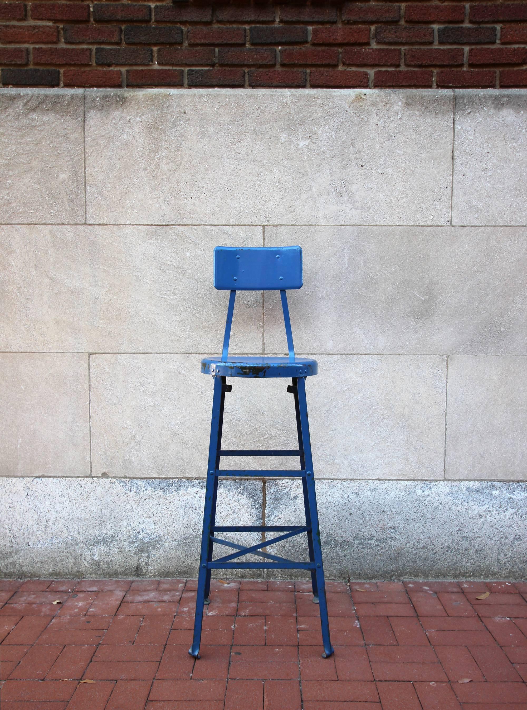 Handsome and unusually tall metal Industrial work stool in vivid blue paint, American, mid-20th century. Very sturdy.