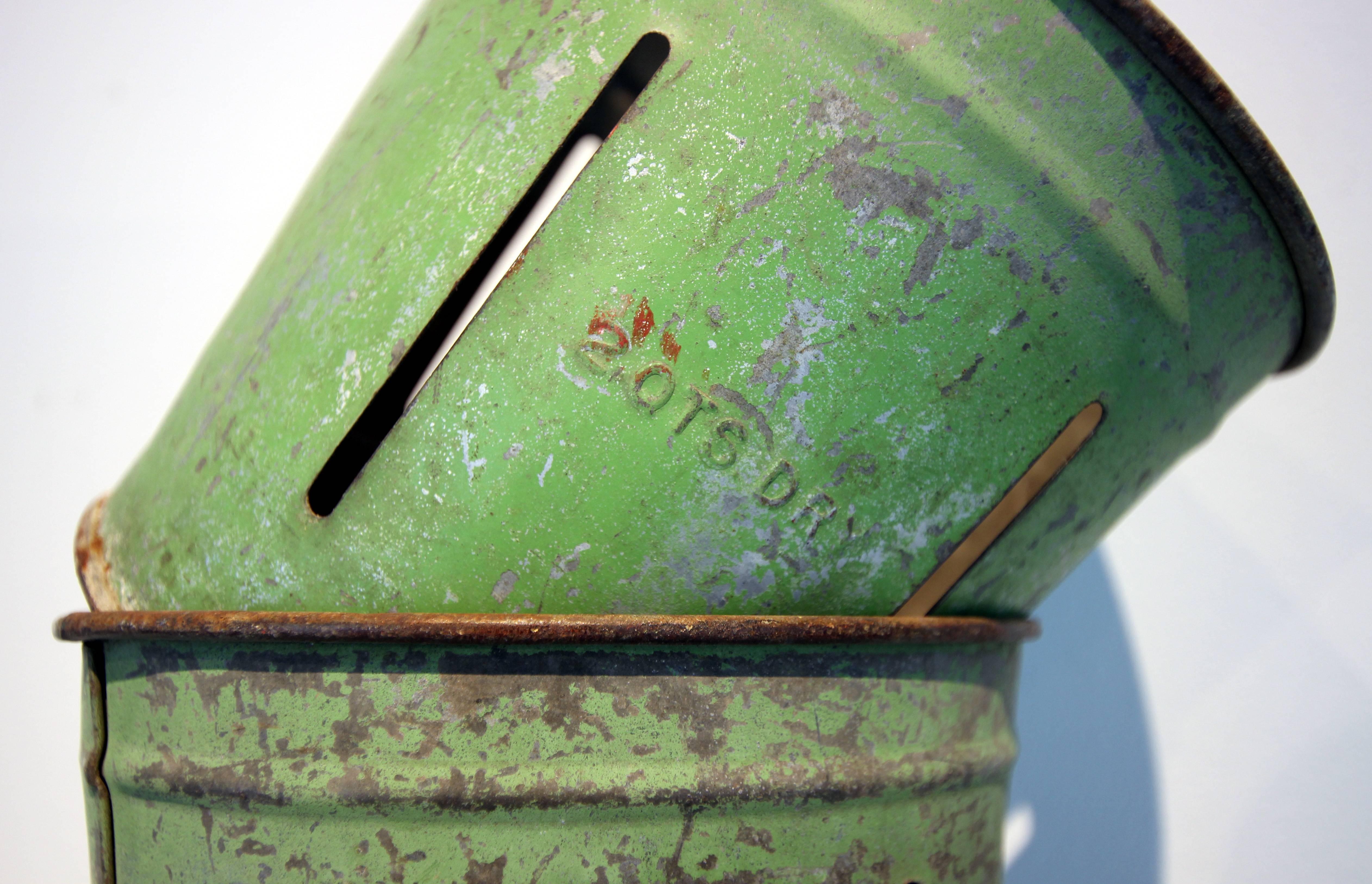 Good looking set of four small painted metal buckets, each is a two-quart measure and with company information on the bottom. Philadelphia, 20th century. Original paint, excellent patina.