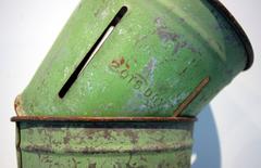 Set of four Green Painted Metal Bucket Measures