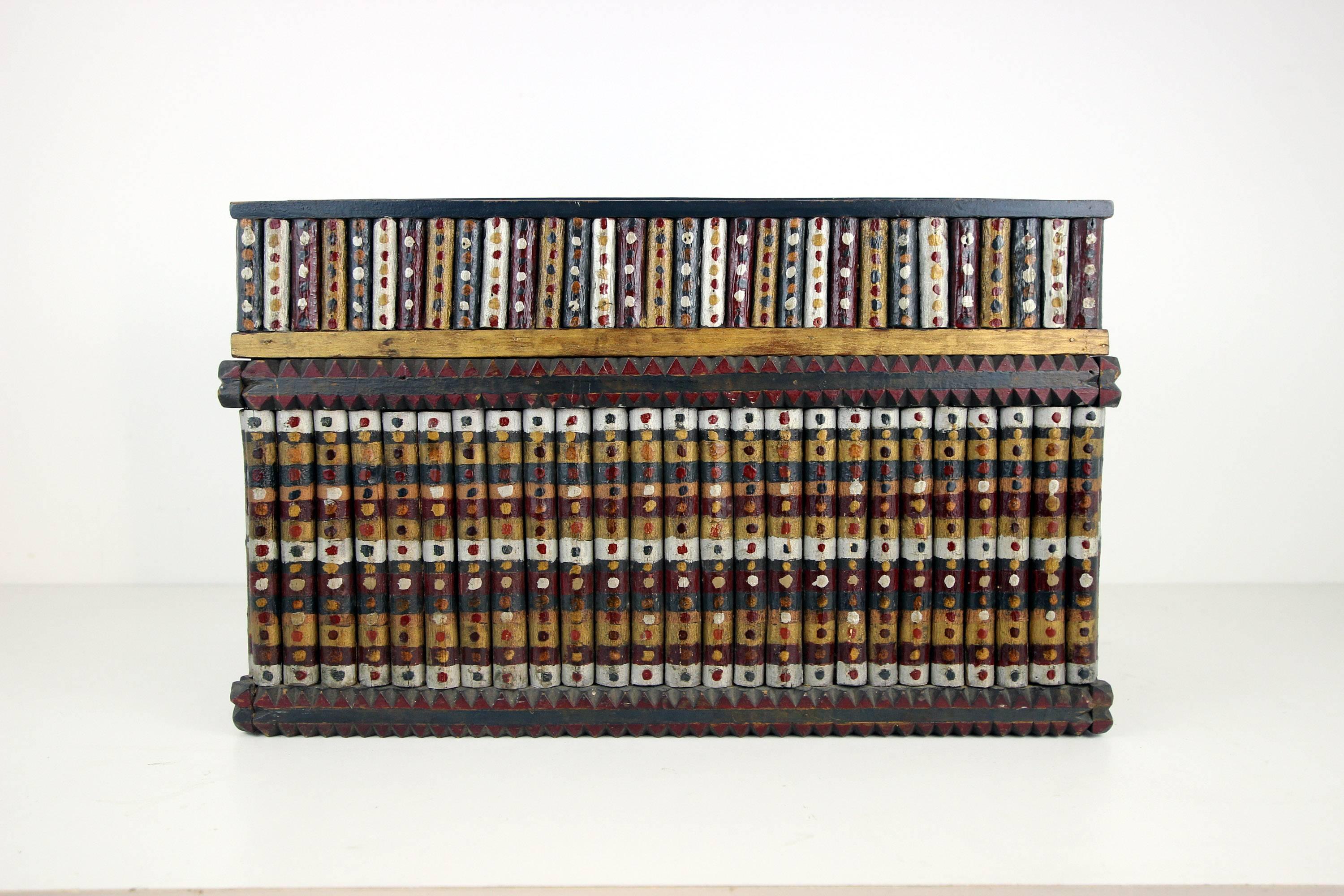 Large Folk Art painted lift top box with notched bands and twig facing throughout, with decoration with inset tray, also paint decorated. Original paint. Great color and whimsy. Midwestern states, circa 1930.