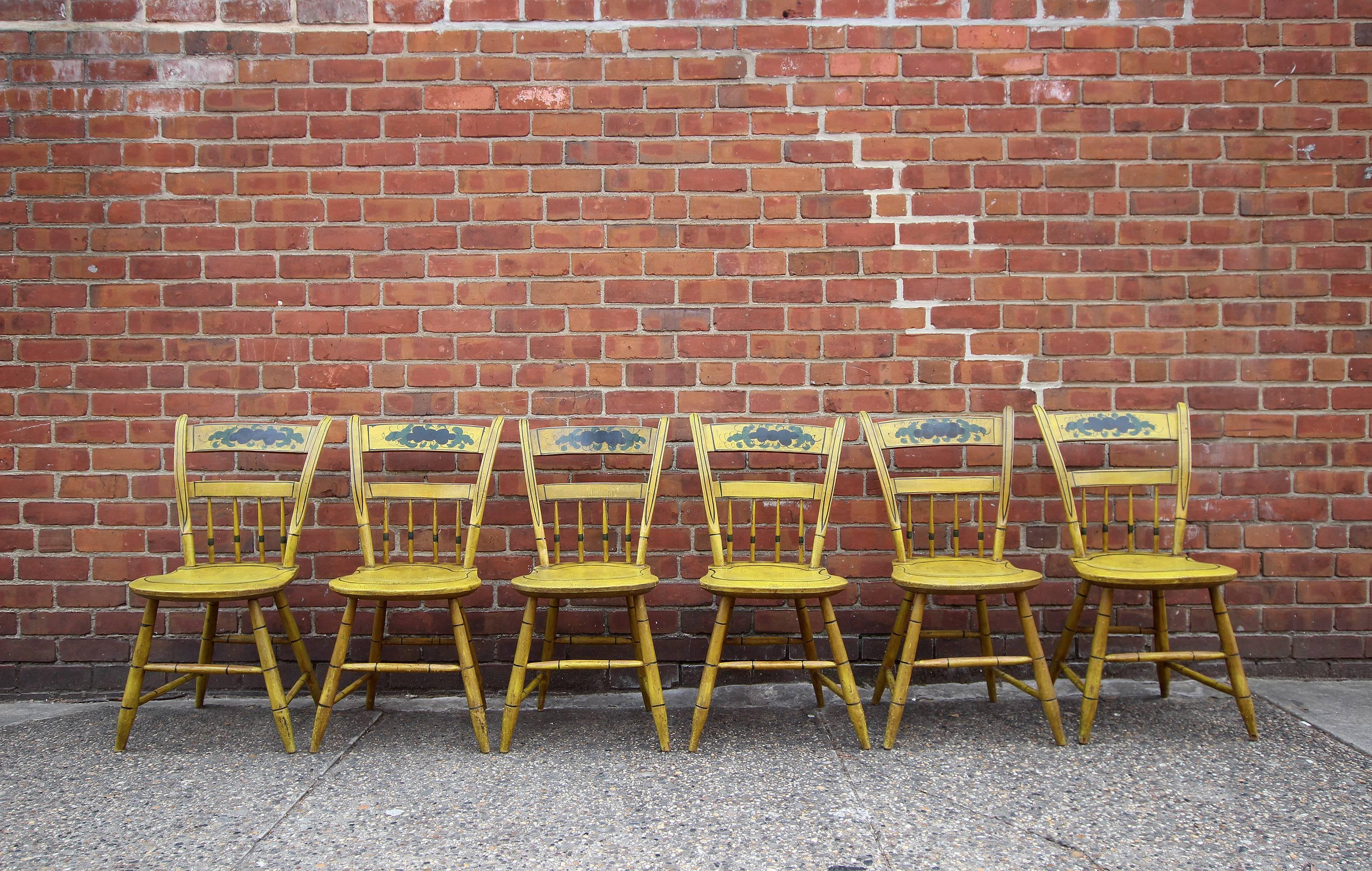 Excellent set of six plank seat half-spindle chairs in original yellow paint and decoration, nice black line details throughout and bamboo turned legs, circa 1840, New England.