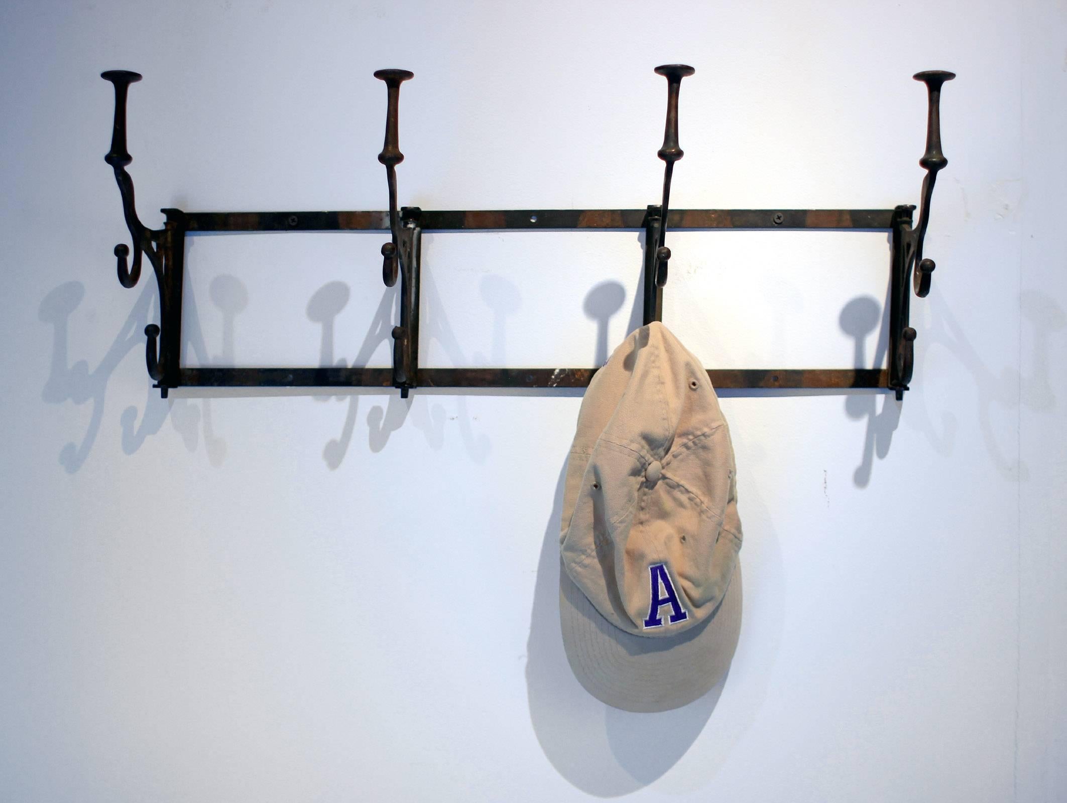 Early 20th Century Iron Rack with Swing-Arm Hooks