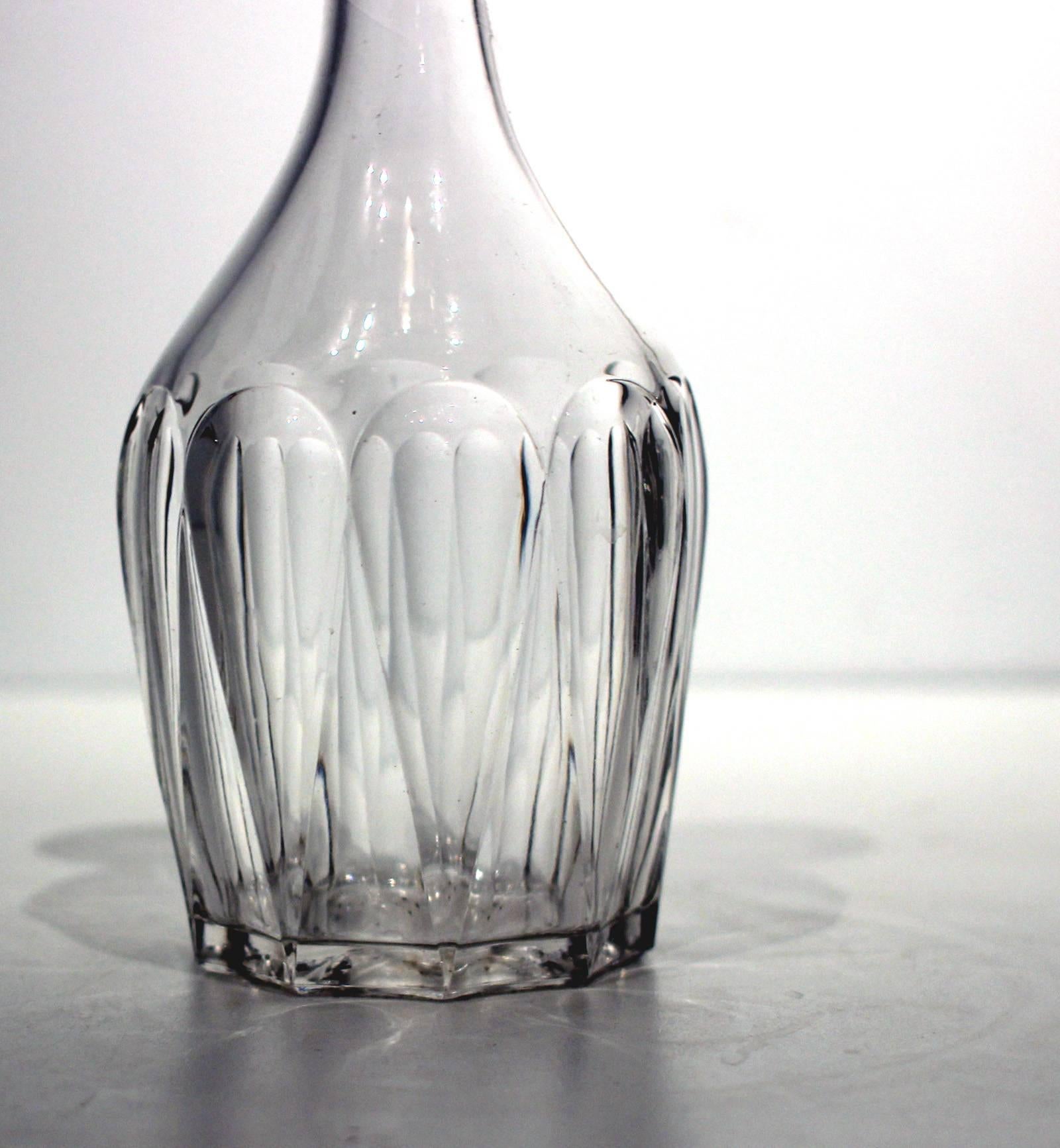 Fine, heavy blown and molded colorless glass bar bottle, of excellent design with 