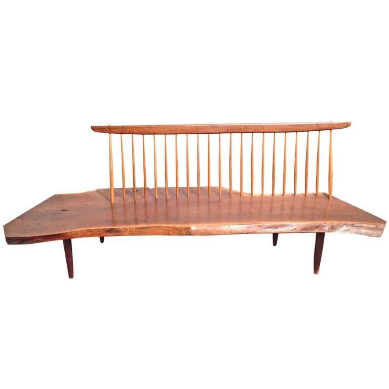 Highly figured American black walnut Conoid bench with one rosewood butterfly, 1964.