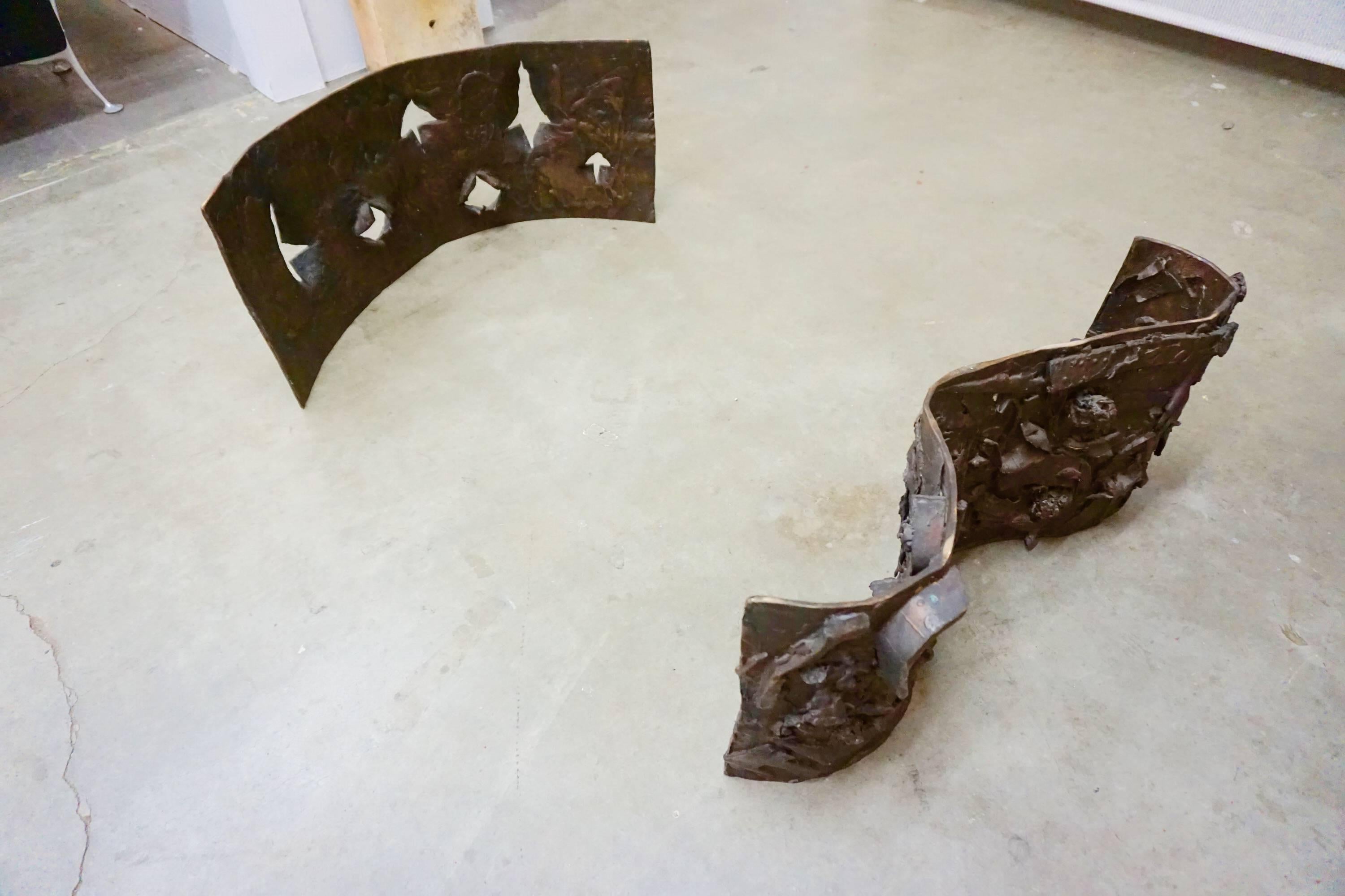 Two-piece, heavy, handcrafted bronze bases. Free-form sculpted and adjustable. Serious addition to your home decor.