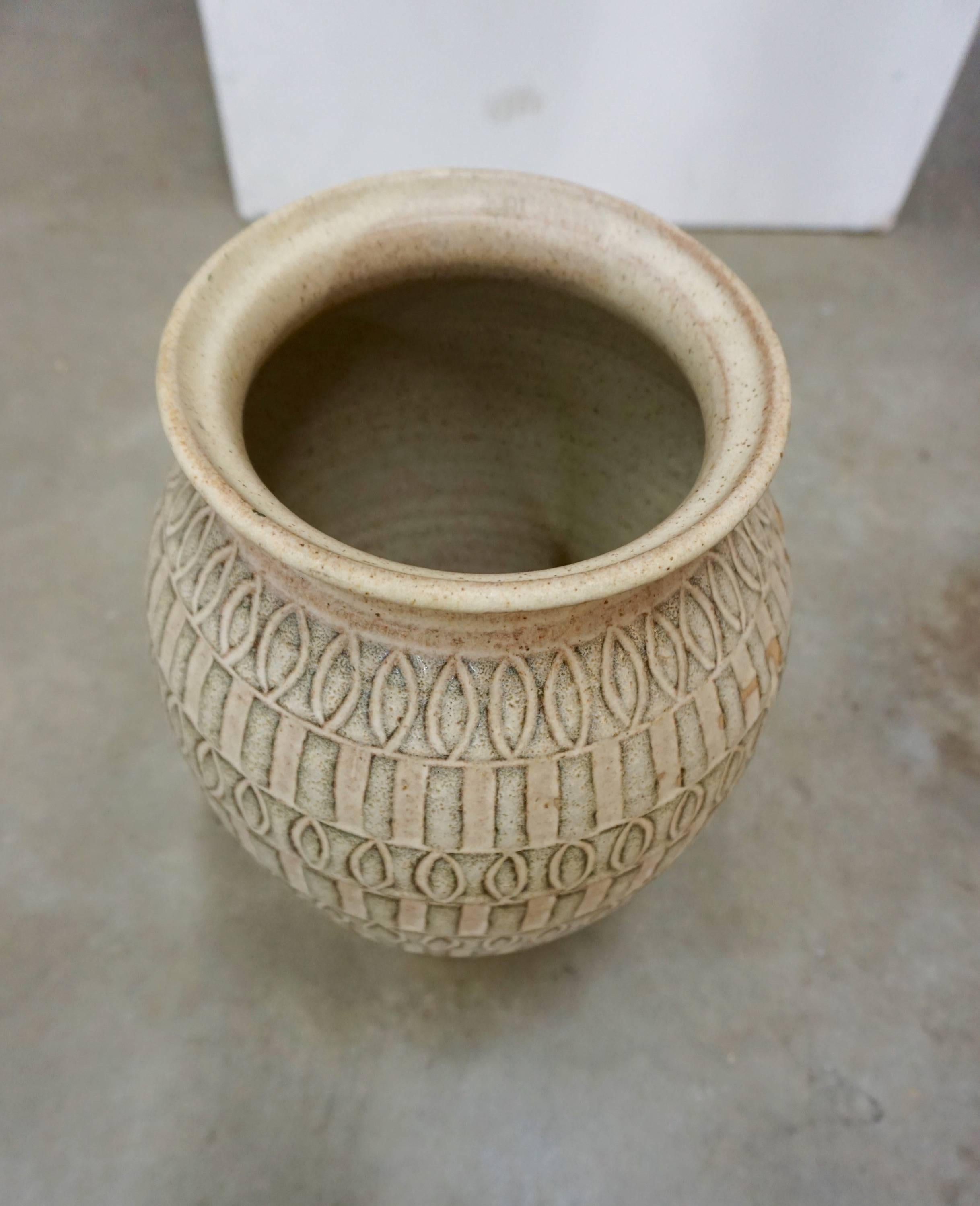 Glazed and incised with an interesting pattern. Could be used as an umbrella stand, planter or purely for decorative value.