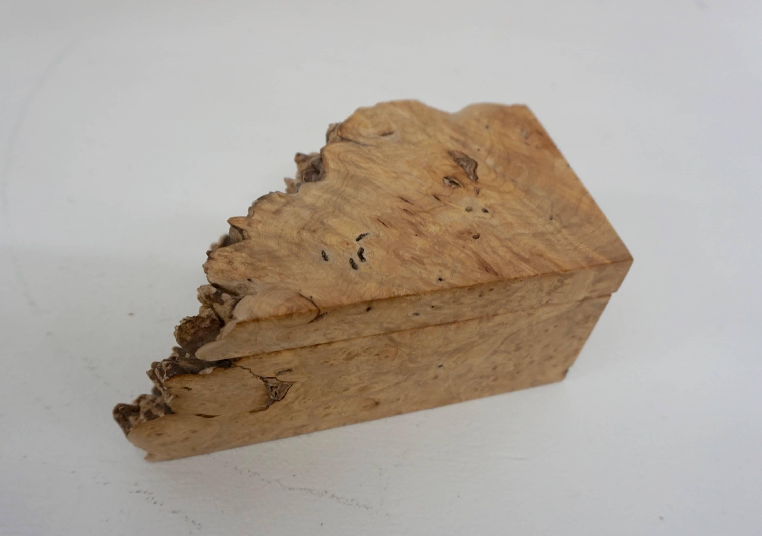 Elkan was a master woodworker in Oregon creating furniture and accessories. This jewelry or stash box is made from olive burl and signed on the bottom.