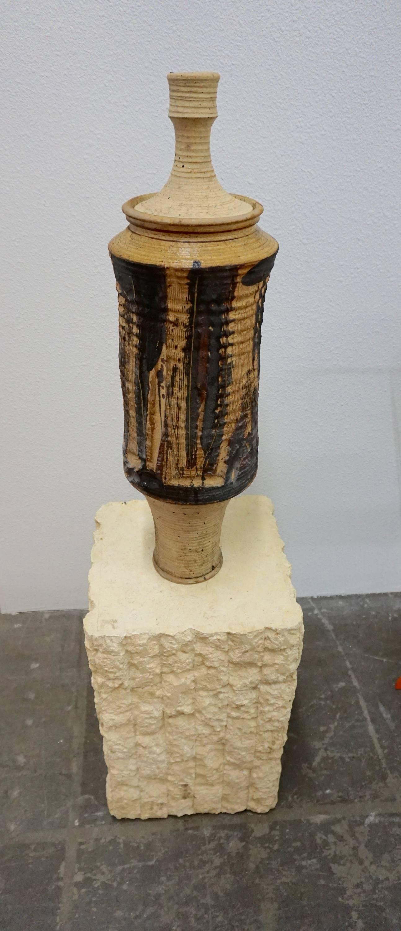 Lidded stoneware vessel, incised and internally glazed. Unsigned but in the style of Ralph Bacera.