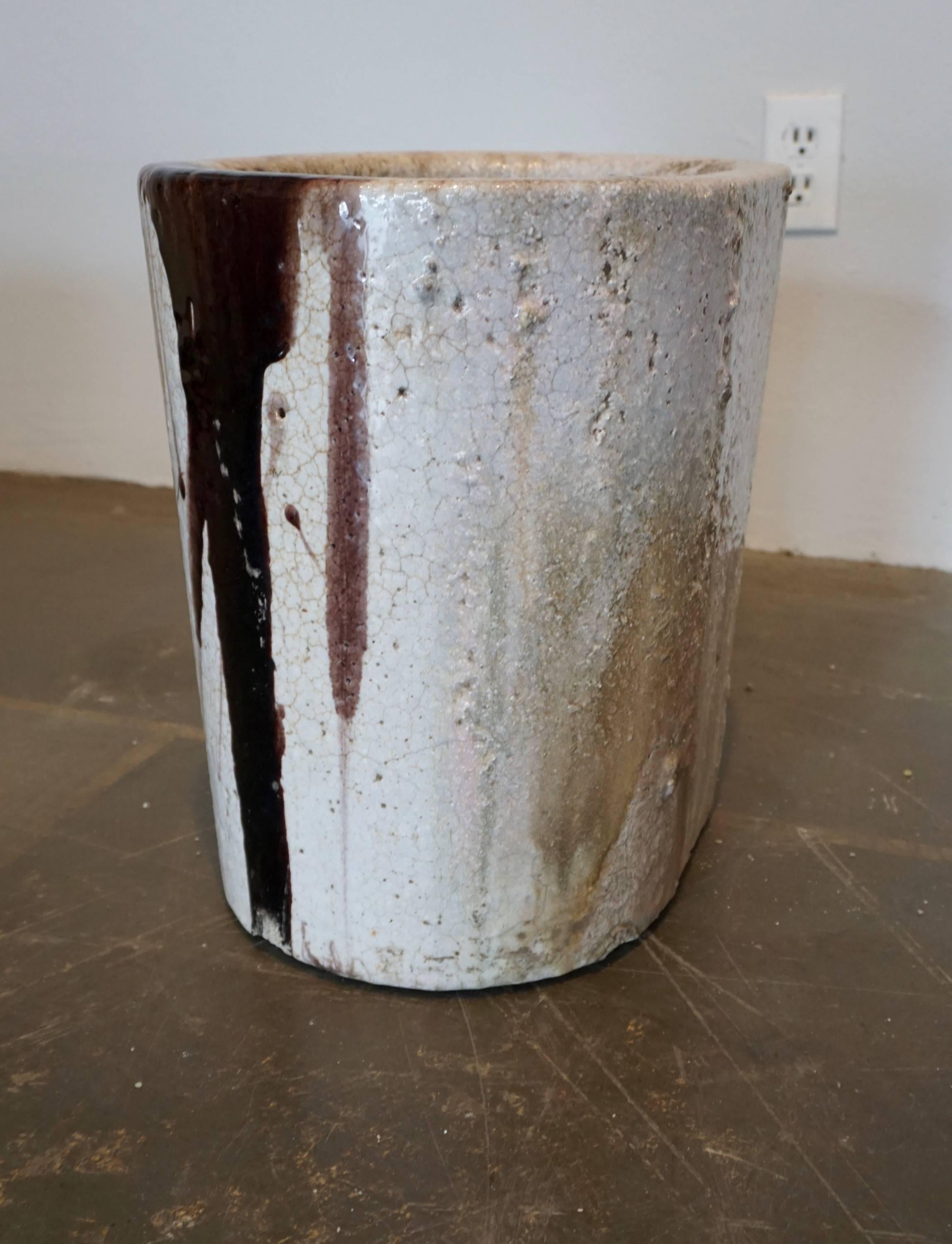 Ceramic vessel used to melt glass at very high temperatures. Enhanced by the crackling and the glass remnants and drippings. Can be used as a planter or decorative object, indoors or outdoors.