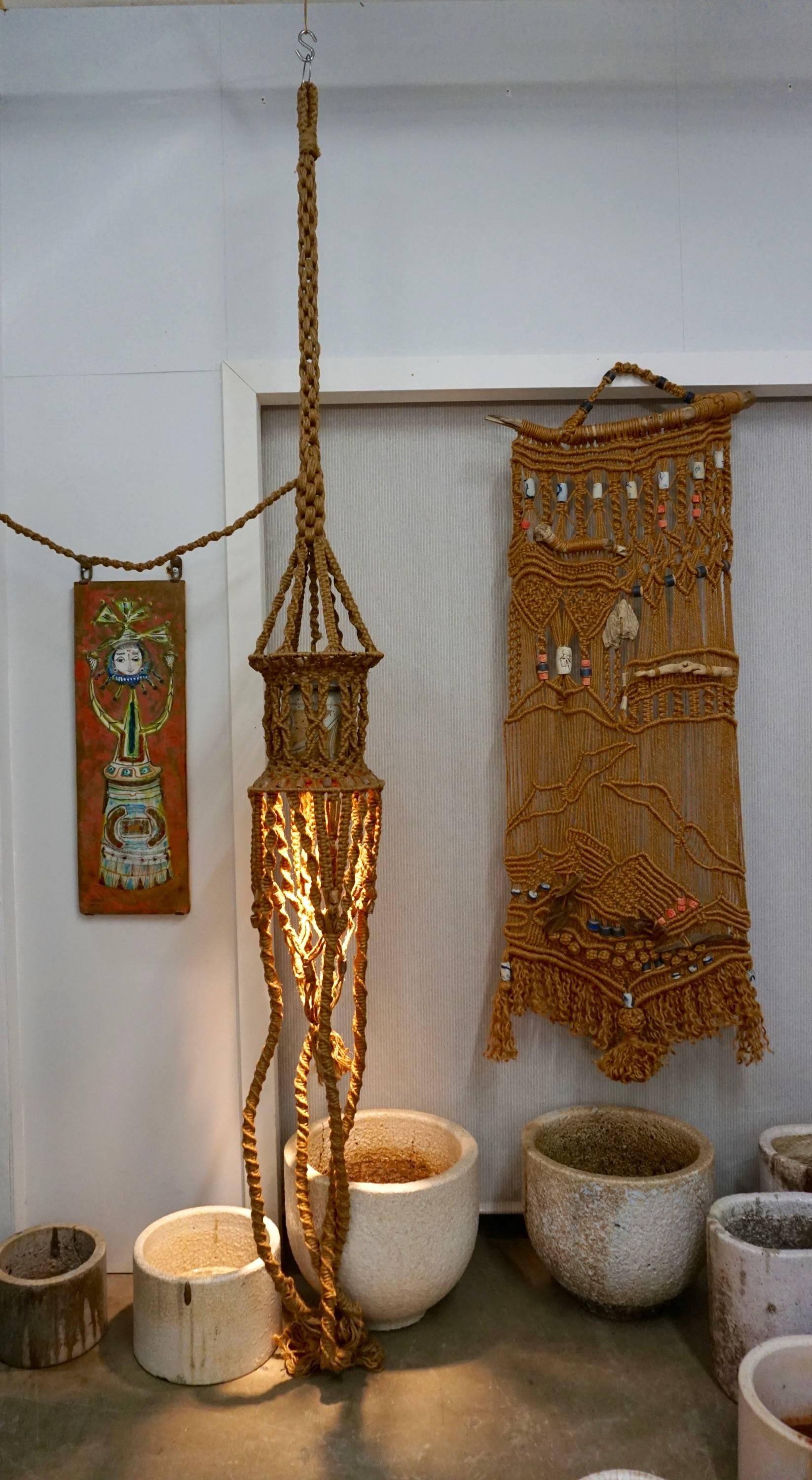 9.5 ft. floor to ceiling macrame lamp with ceramic shade and macrame swag.
ceramic beads incorporated in to the lamp.