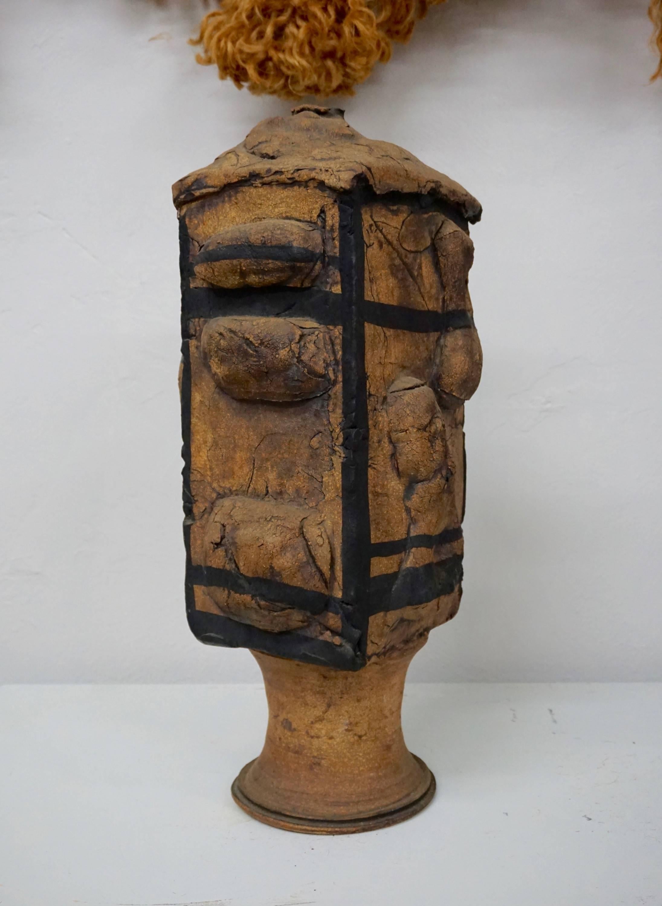 Earthenware vessel, slab construction on wheel turned base.
Matching larger vessel available.
