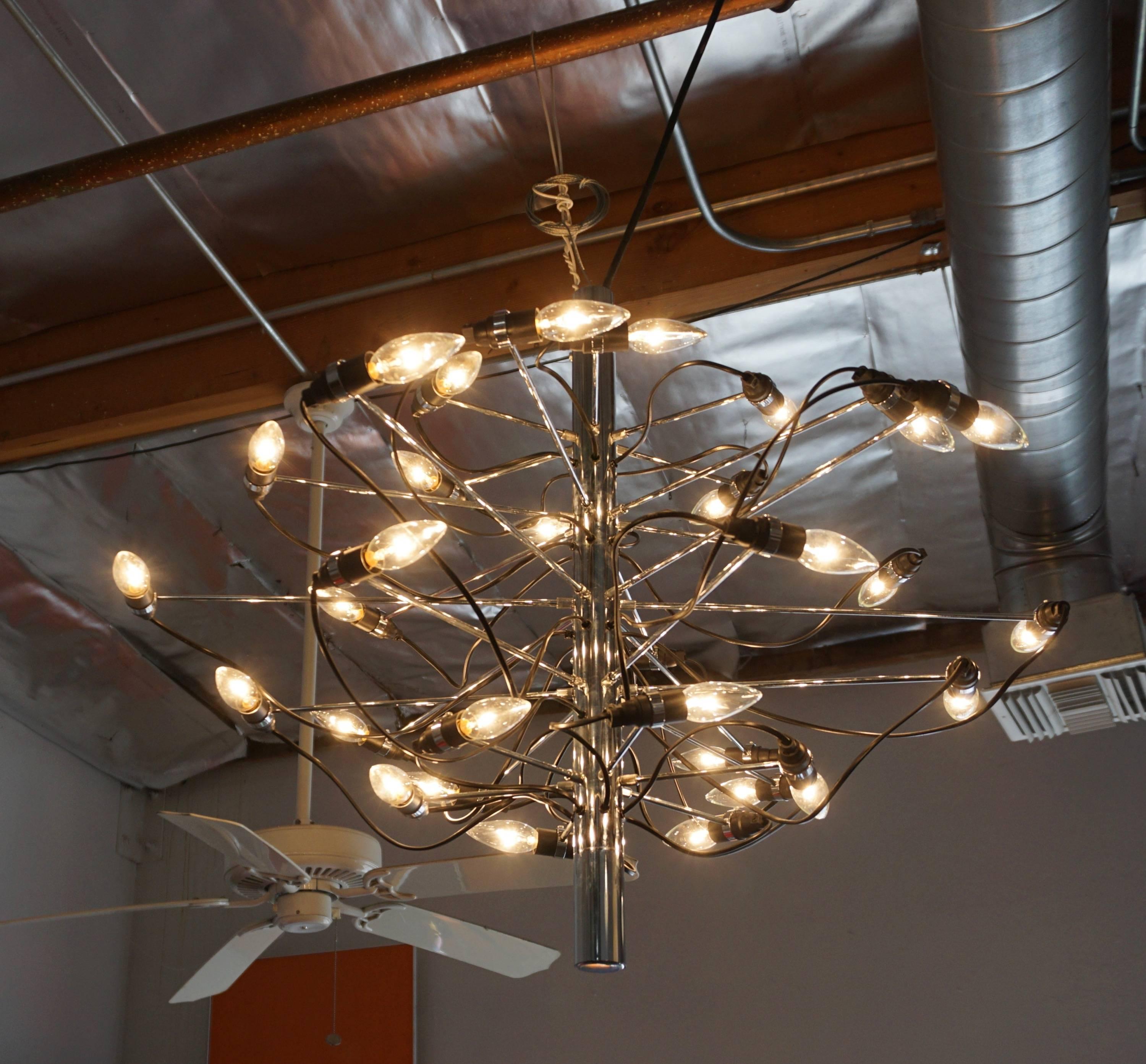 Chrome-plated steel hanging chandelier with adjustable swivel light sockets.
A real stunner!