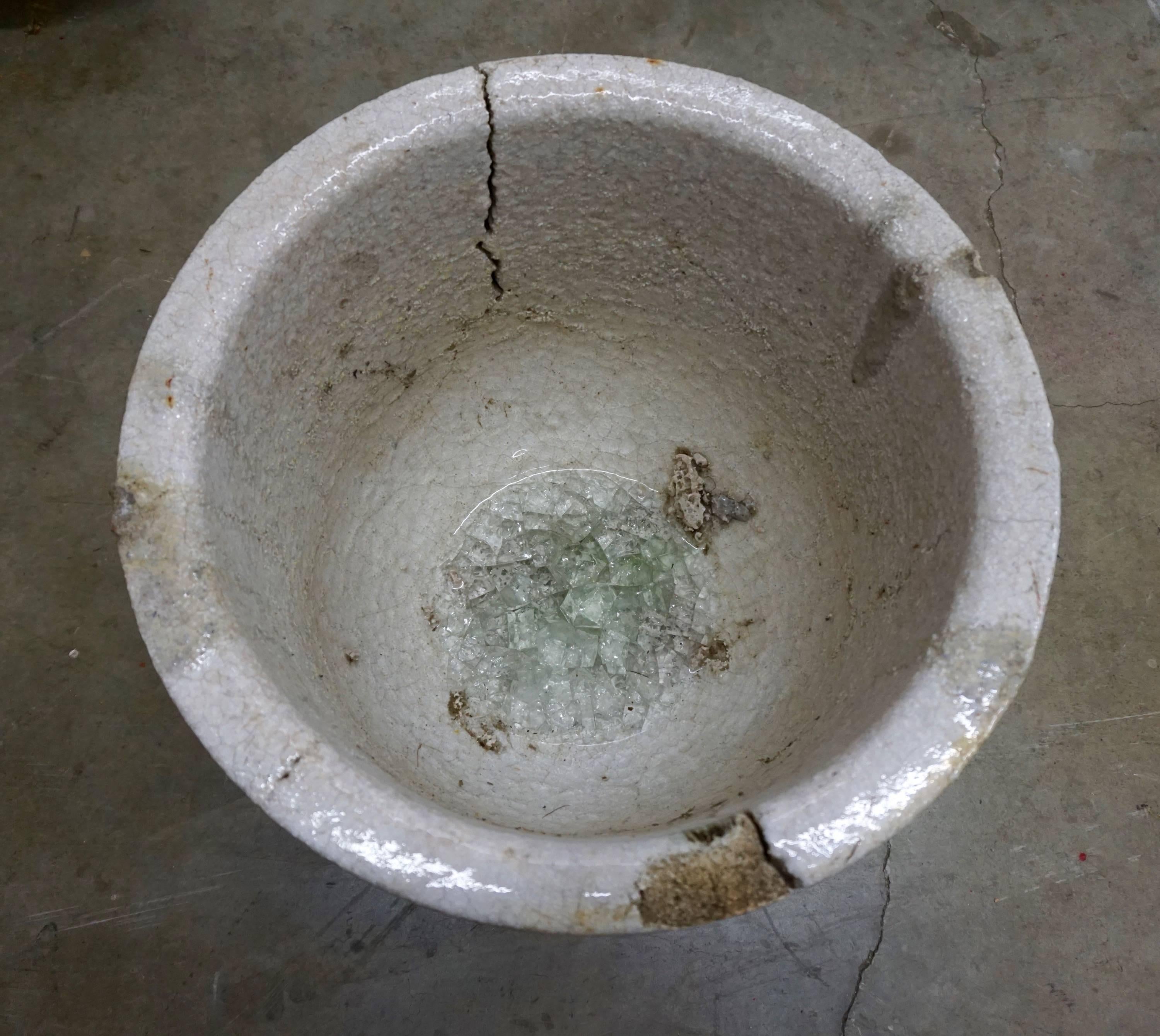 Ceramic vessel used by glaziers to melt glass at very high temperatures. Enhanced by the crackling, glass remnants and drippings. Can be used as a planter or decorative object, indoors or outdoors.
Multiple crucibles available.