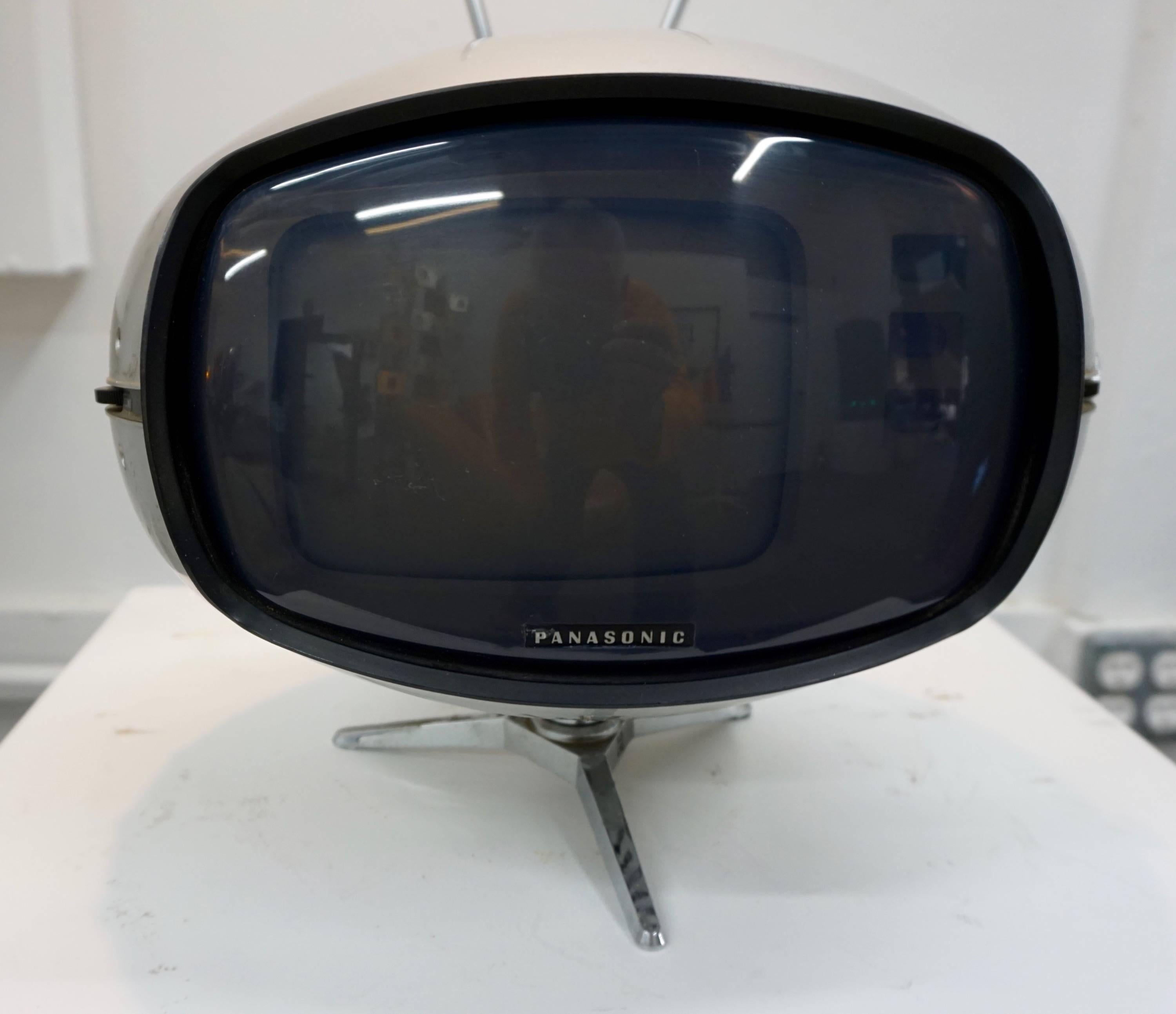 Designed and manufactured in 1971 by Panasonic, Japan. Black and white analog screen that would require a cable box converter to receive a picture. There is a working static image presently and some minor scuffs to the casing.