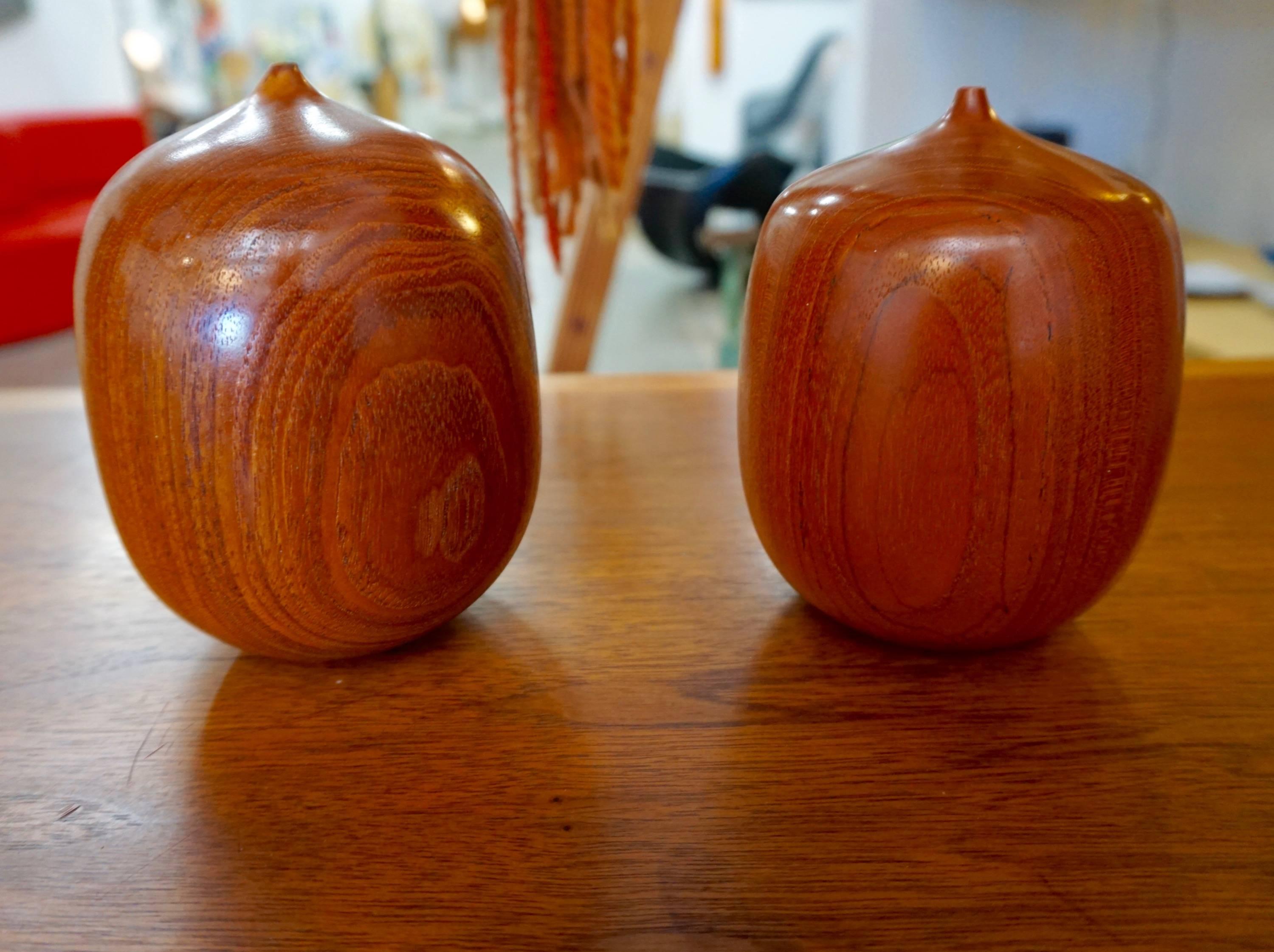 Beautifully executed vases from Burmese teak. Available individually or as a pair.