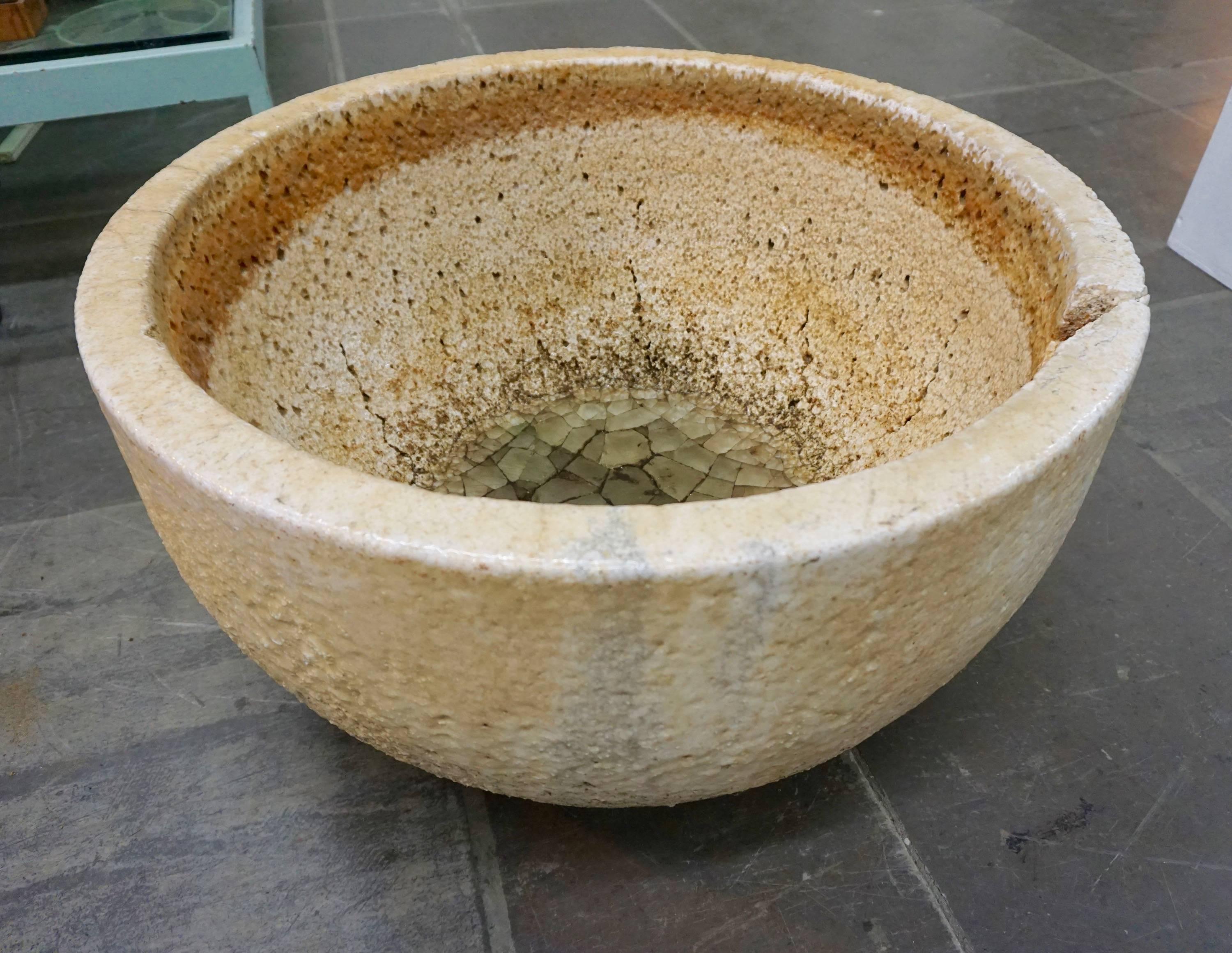 Ceramic vessel used by glaziers to melt glass at very high temperatures. Enhanced by the crackling, pitting, glass remnants and drippings. Can be used as a planter or decorative object, indoors or outdoors.
Multiple crucibles available.