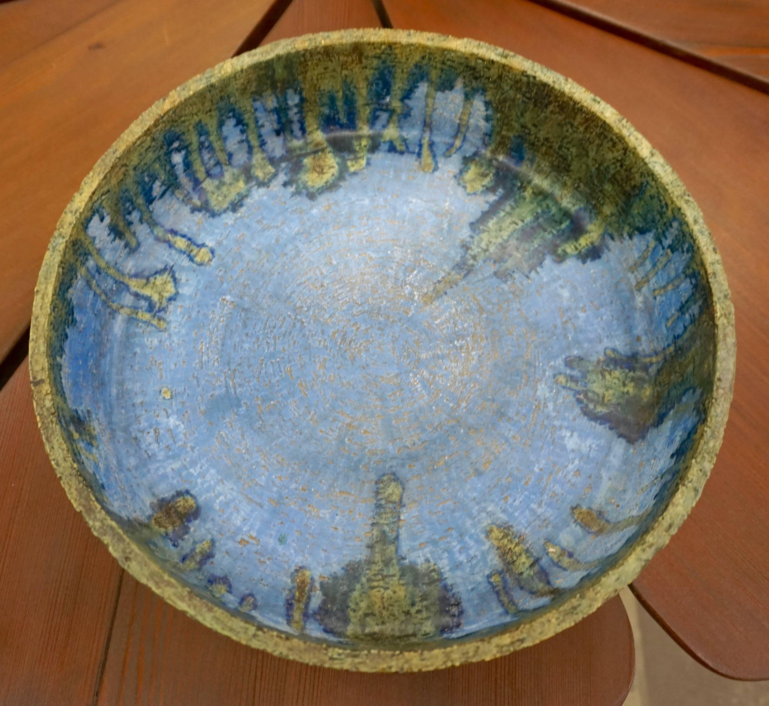 Beautiful stoneware bowl with a drip glaze signed 