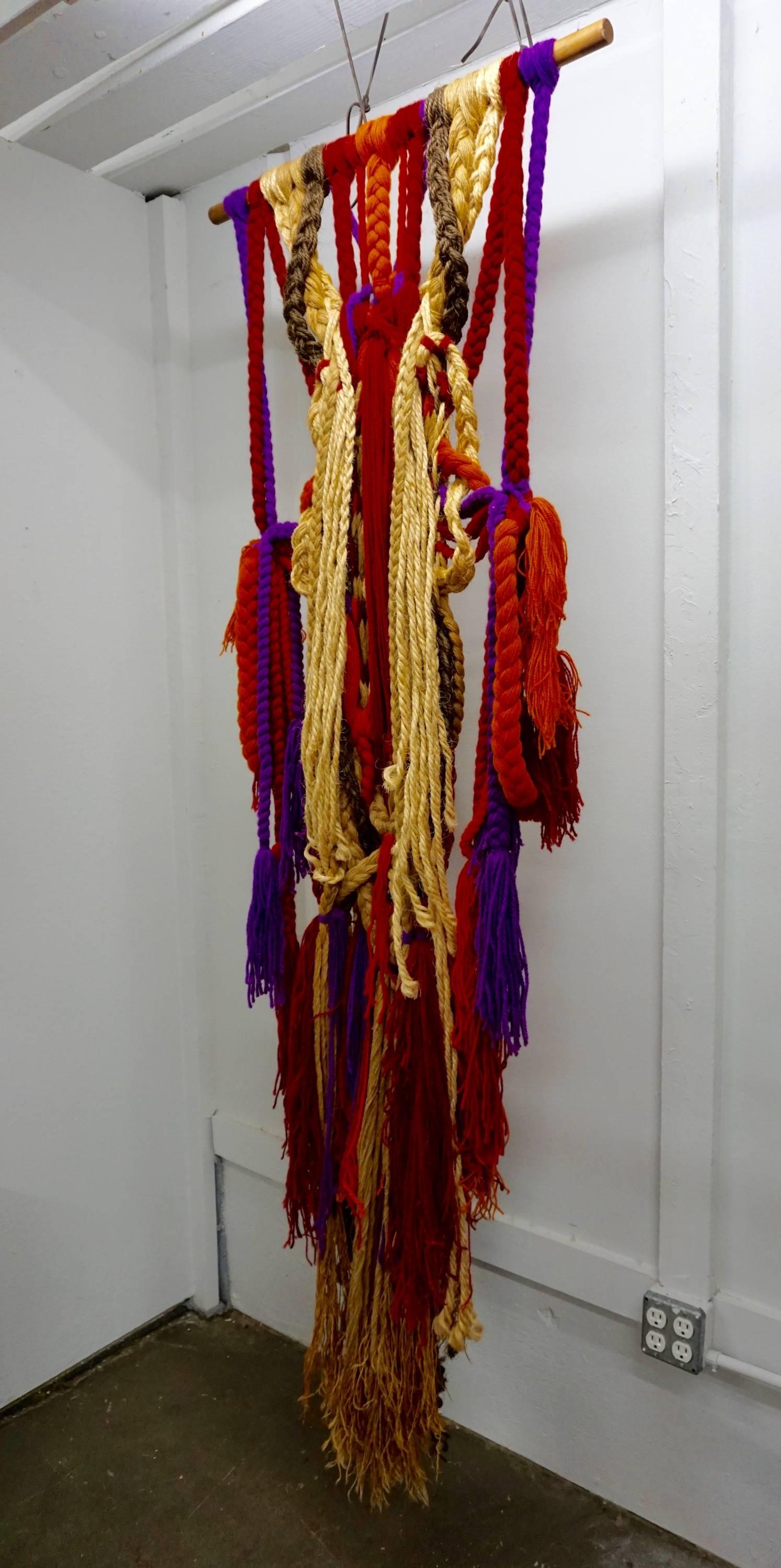Bright multicolored yarns interwoven with braided wool, jute and twine. A bold statement in any setting.