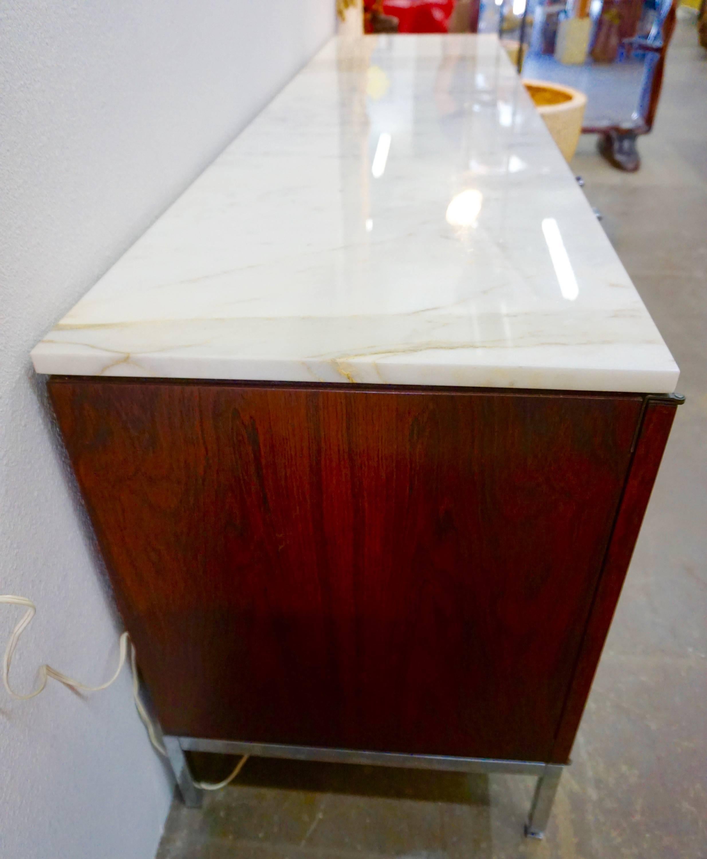 Exceptional bookmatched rosewood grain, Carrara marble top, chromed steel base and pulls. Great for home or office.