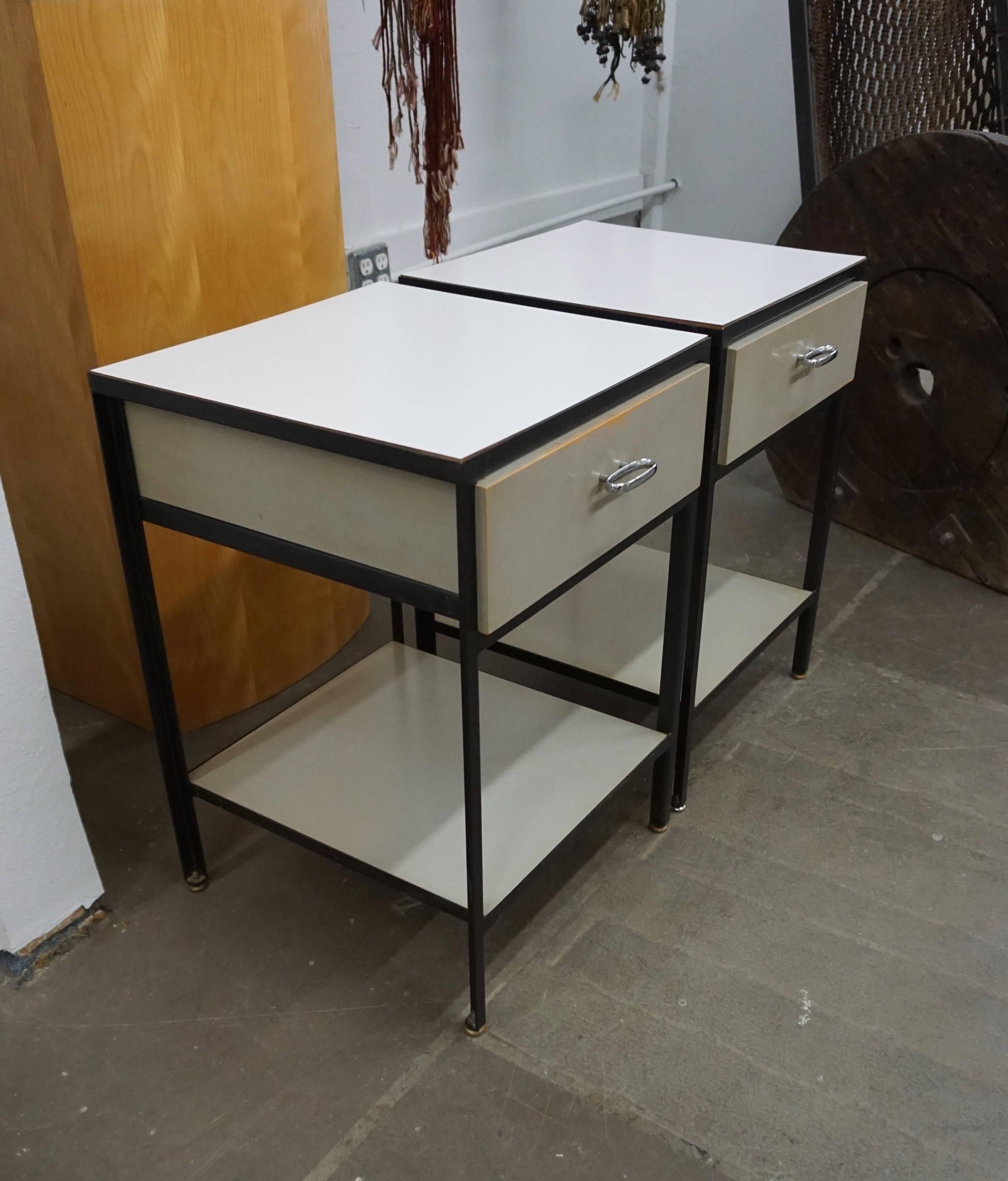 Practical design by Nelson for Herman Miller. Exposed black frame with gray drawer and white laminate top and undercarriage. Gently used condition with some paint loss to tops of drawers.