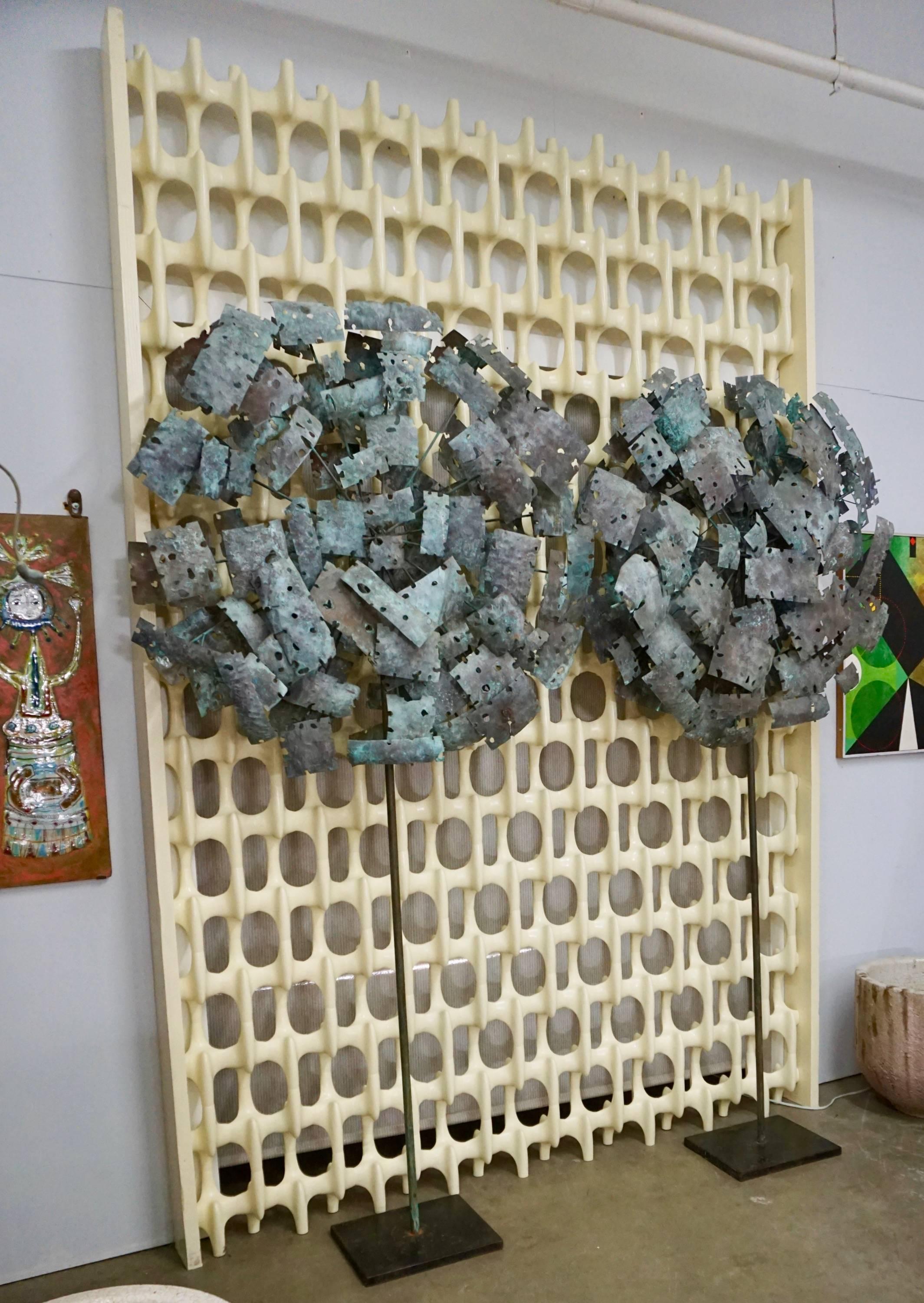 Tree like abstract sculptures with torch cut copper leaves, double sided and nicely patinated . Mounted on steel rods and squares steel bases. Each piece measures 92
