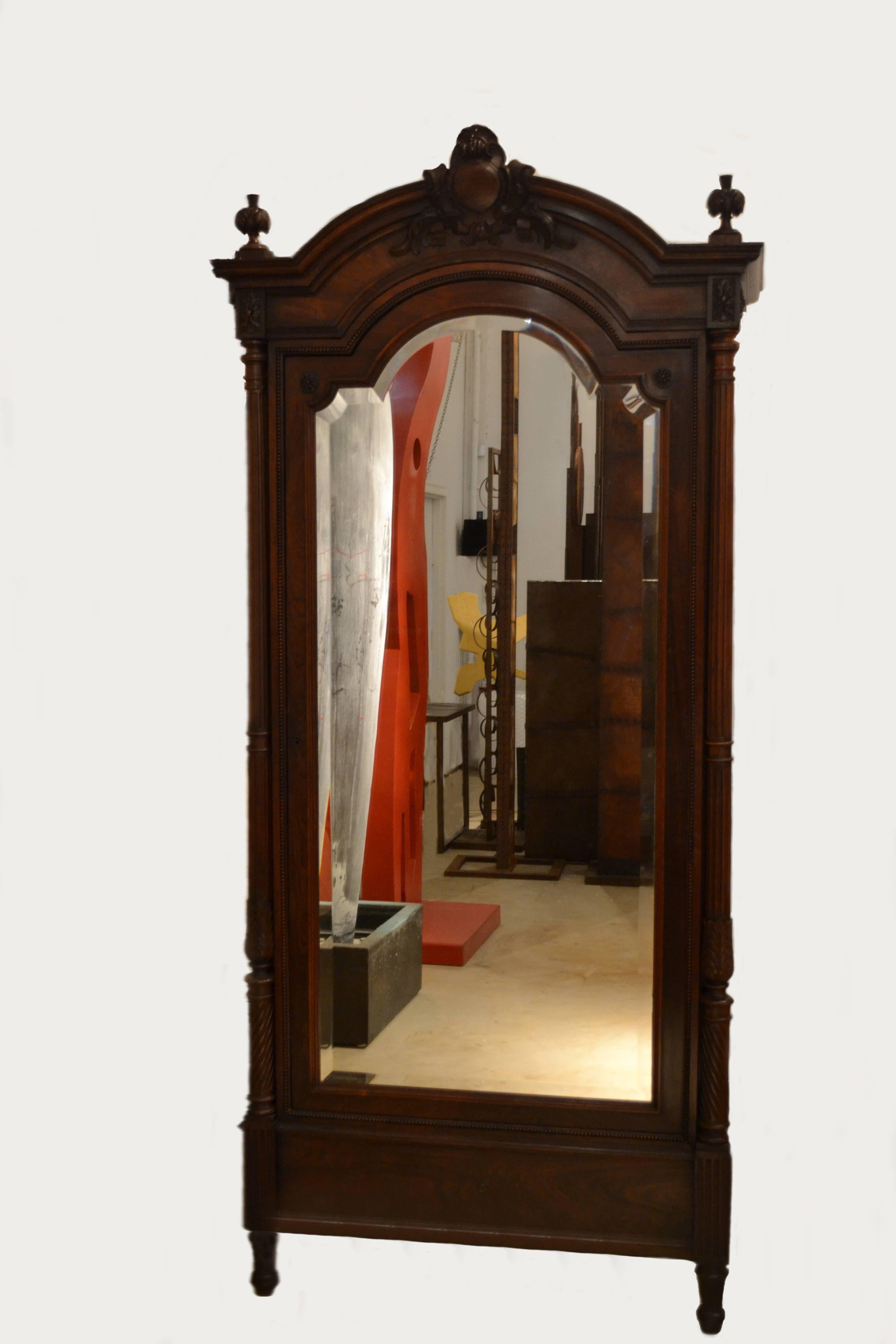 An exceptional Louis XVI rosewood armoire with bevelled mirrored door, France, circa 1870s in nearly mint condition. Some minor alterations to the interior of the armoire. The armoire's provenance is that it originates from the estate and Palm
