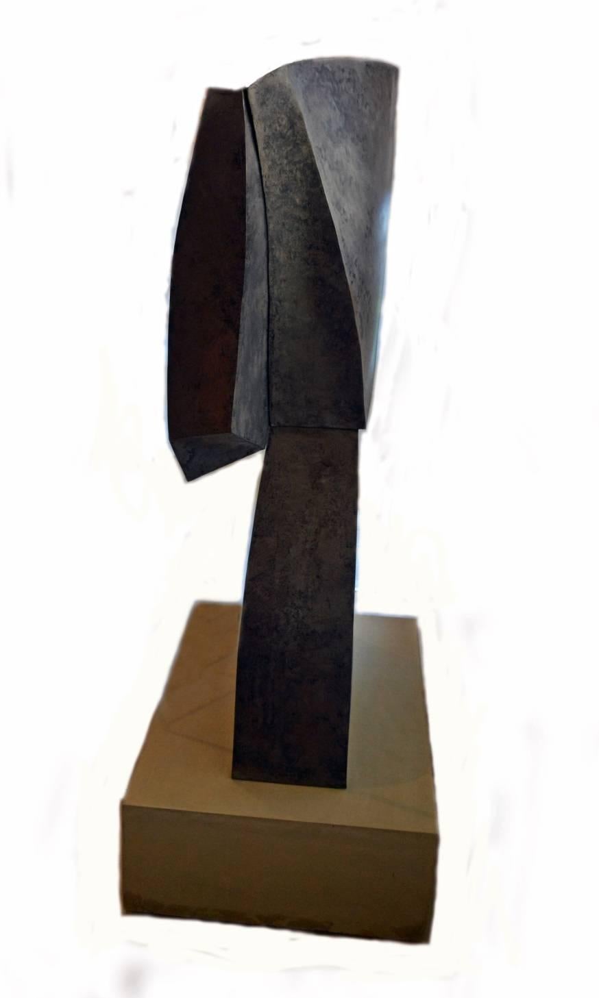 California artist Scott Donadio (b. 1961), handcrafted various shapes out of steel and welded them together to create this beautiful abstract sculpture that stands over five feet tall. It rests on a twelve inch tall custom concrete base and secured