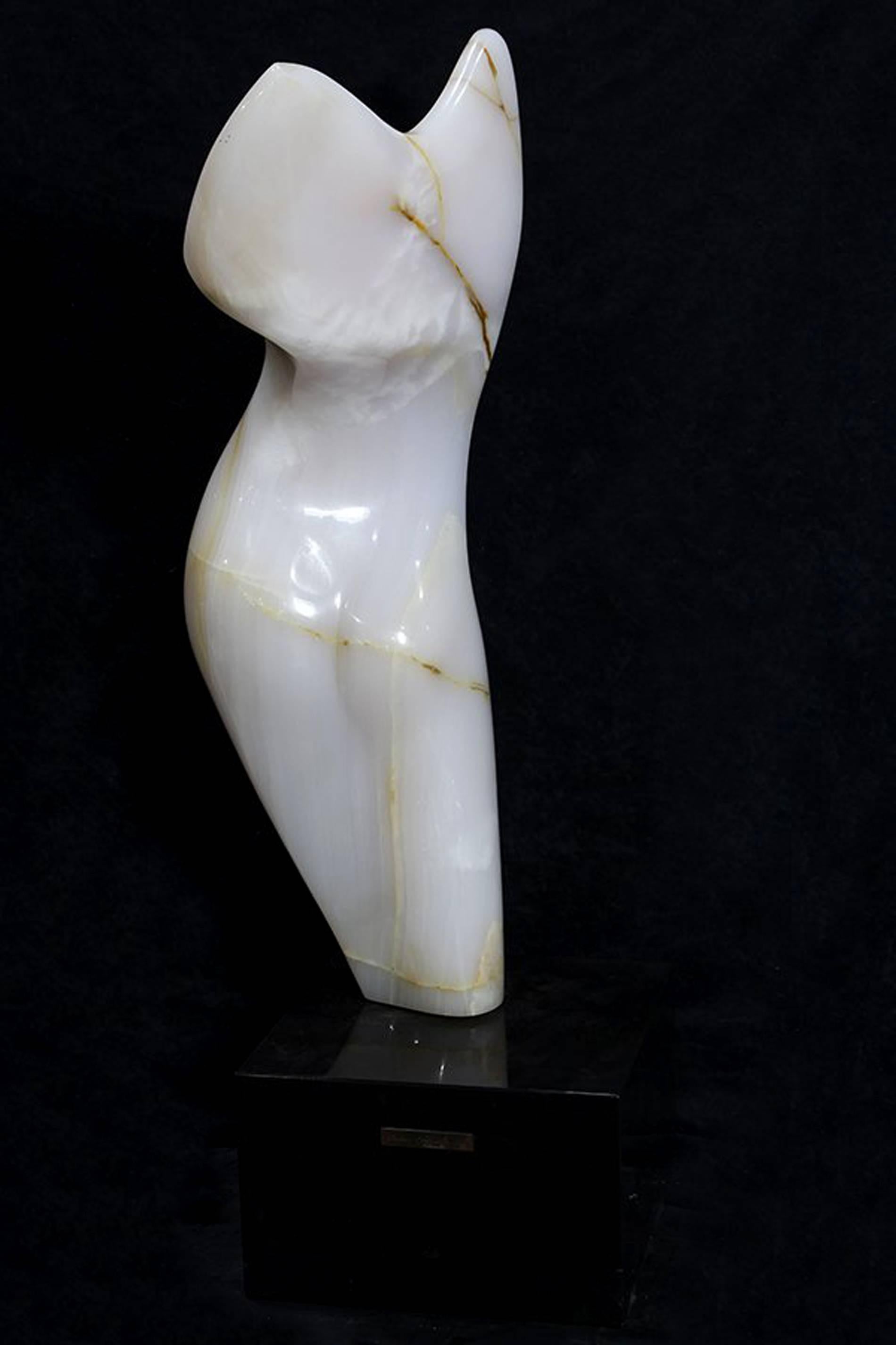 Abstract sculpture of female torso by artist Robert I. Russin (1914-2007). Carved from Turkish Onyx and titled 