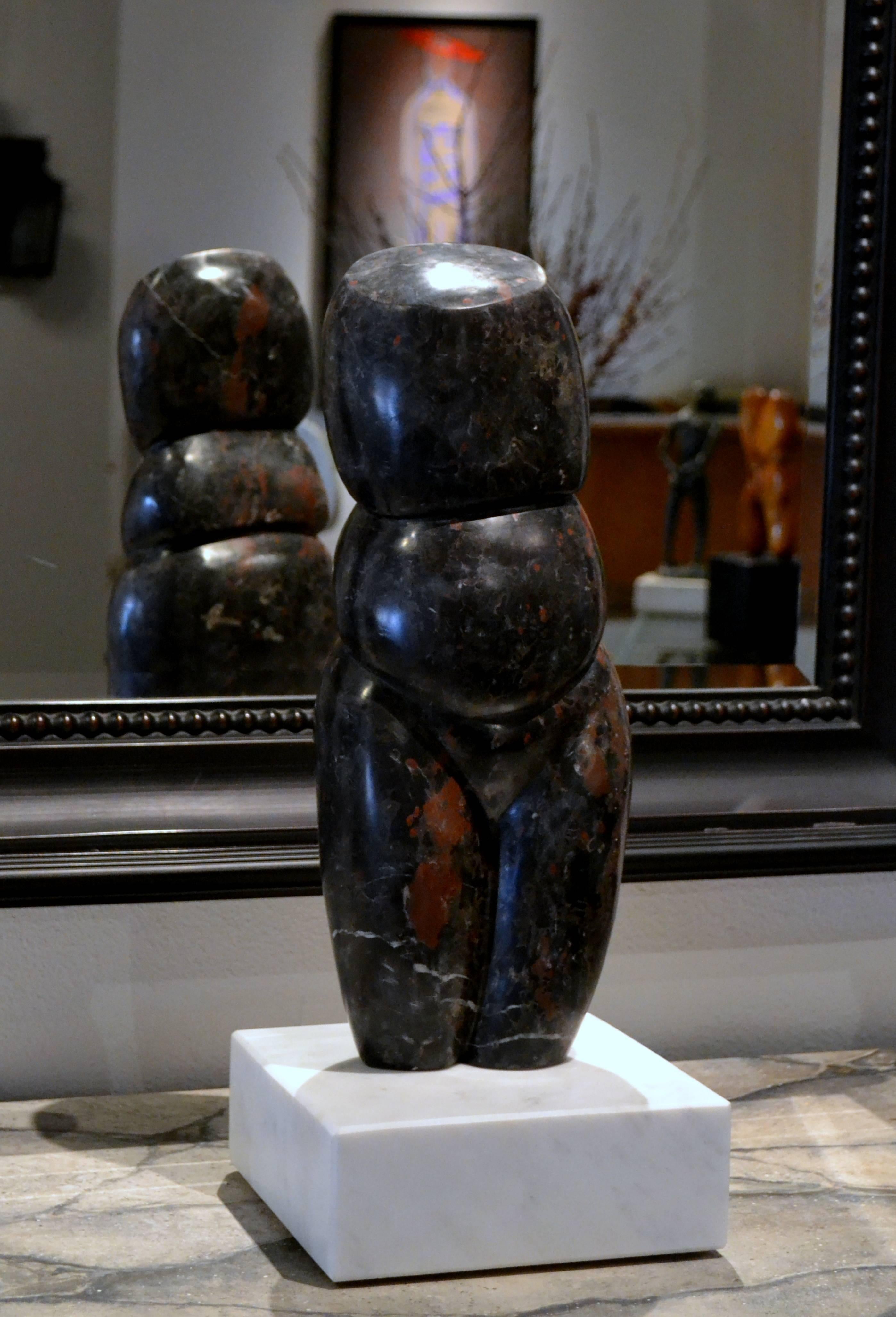 This elegant and exceptionally carved abstract sculpture of a female torso by listed artist Scott Donadio (b. 1961) is titled MY GEISHA. It is carved from a beautiful black California marble with deep red veining. The sculpture is mounted on a white