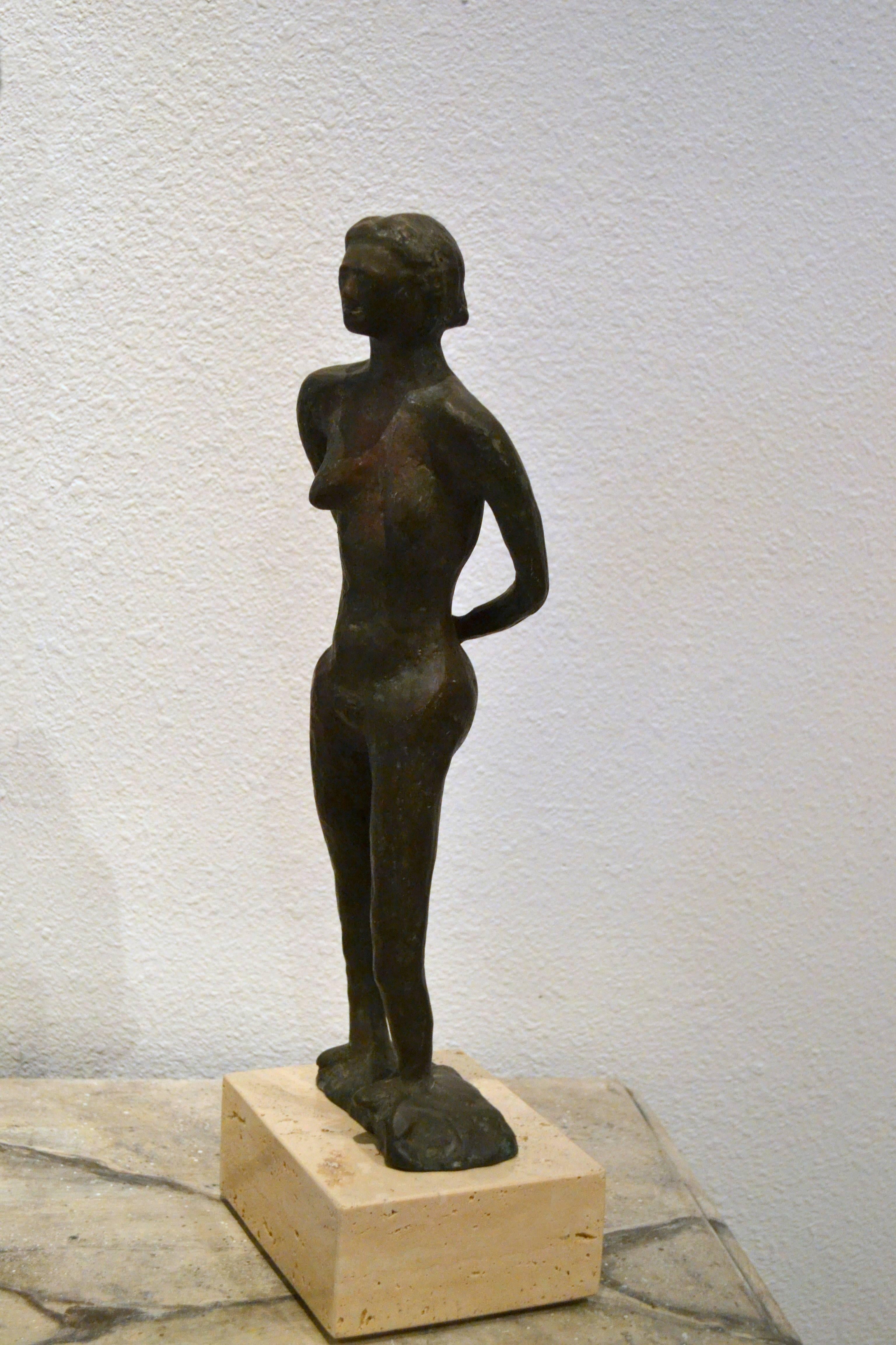 An exceptional vintage bronze sculpture of a female nude, believed to be late 1940s early 1950s. The artist is unknown. The facial details and expression and the deep set shoulders make this a very interesting piece and desirable piece, as does its