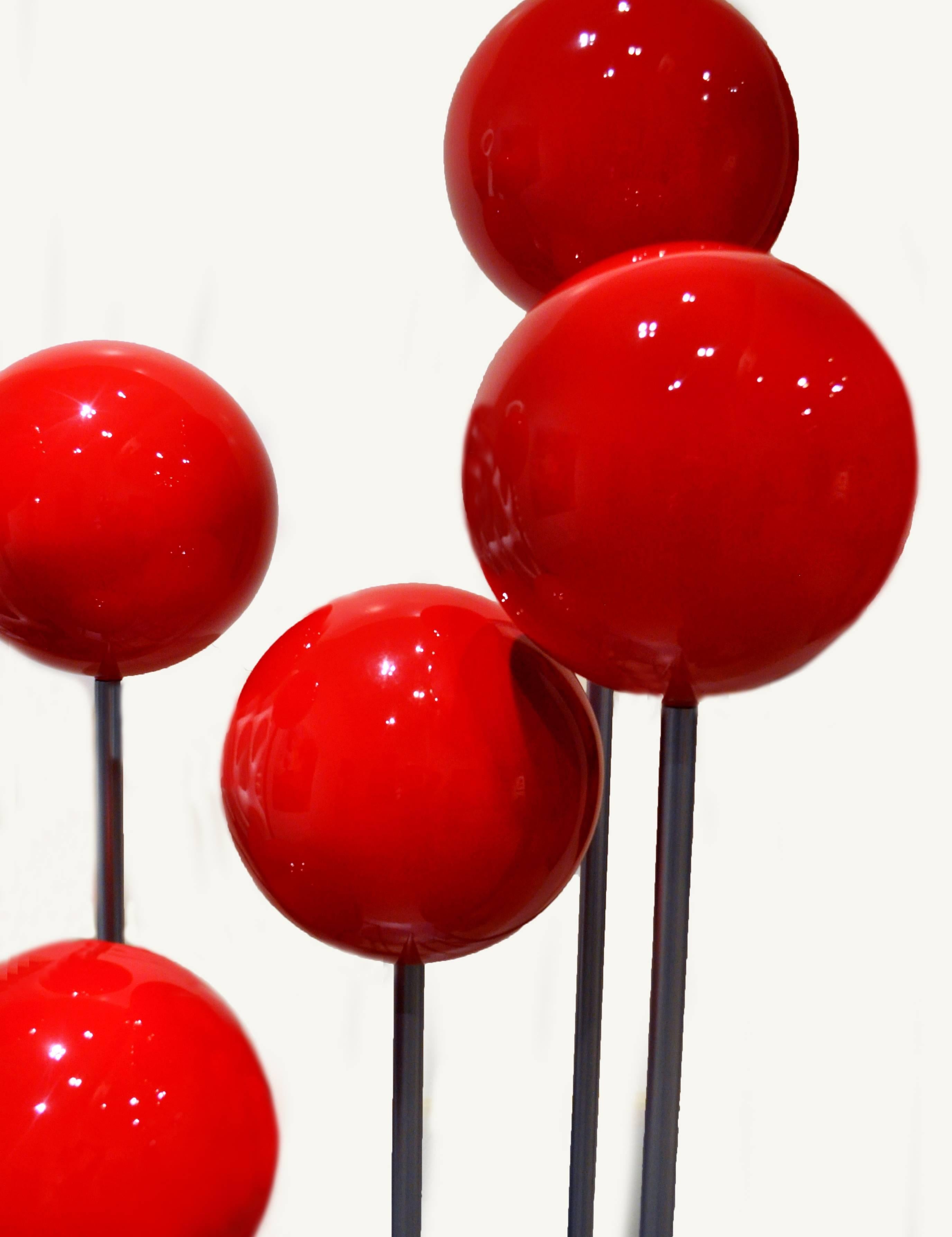 In his earlier career, artist Robert Marion (born 1939) was an award winning auto designer before turning full time to creating what he calls Minimalist architectural sculptures. This modern and whimsical sculpture titled Balls of Fire III, is