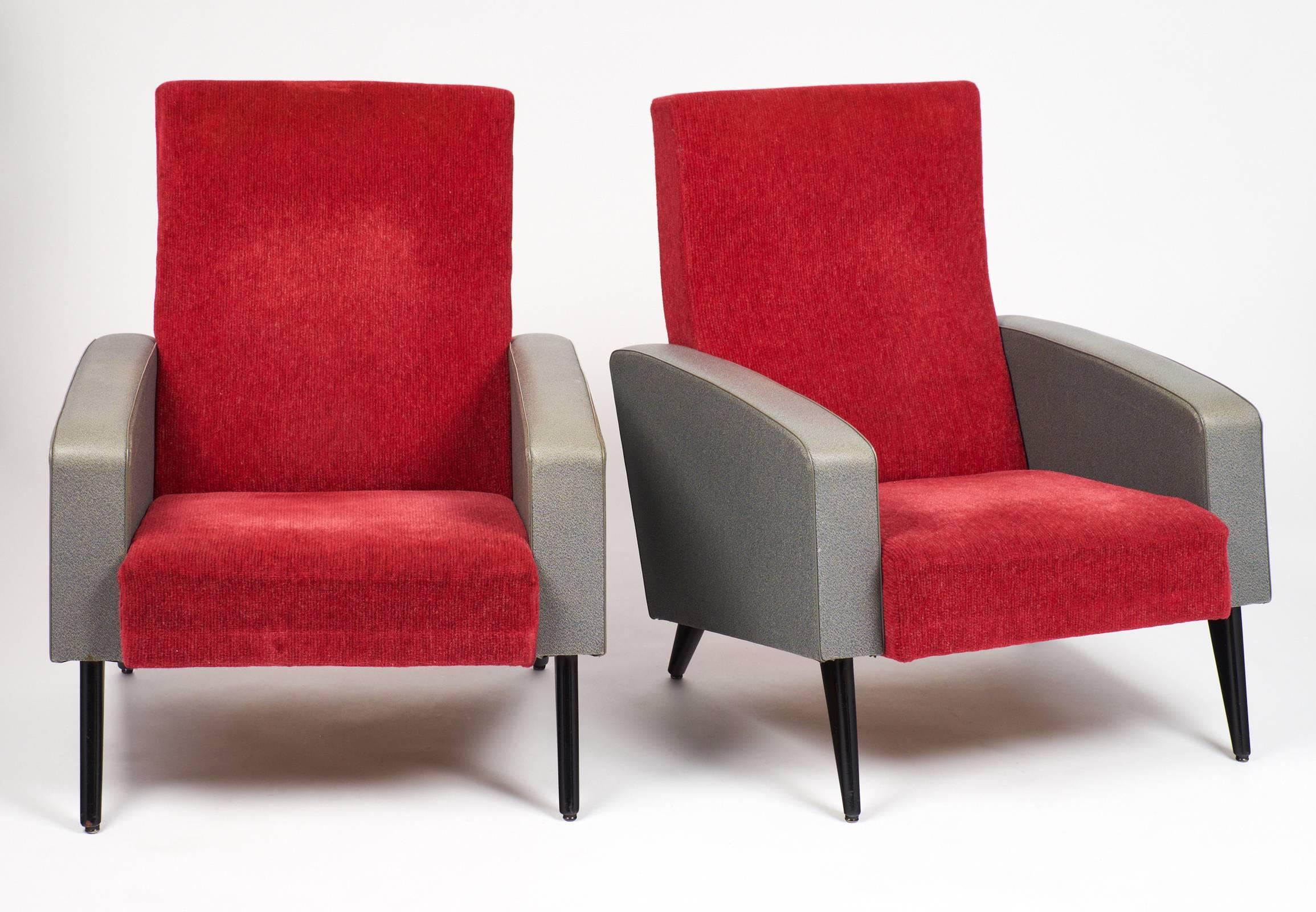 Pair of French modernist armchairs with their original vinyl and velvet in the manner of Pierre Guariche. Black lacquered legs.
